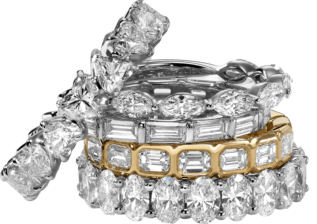 Stack of diamond rings on a green background.