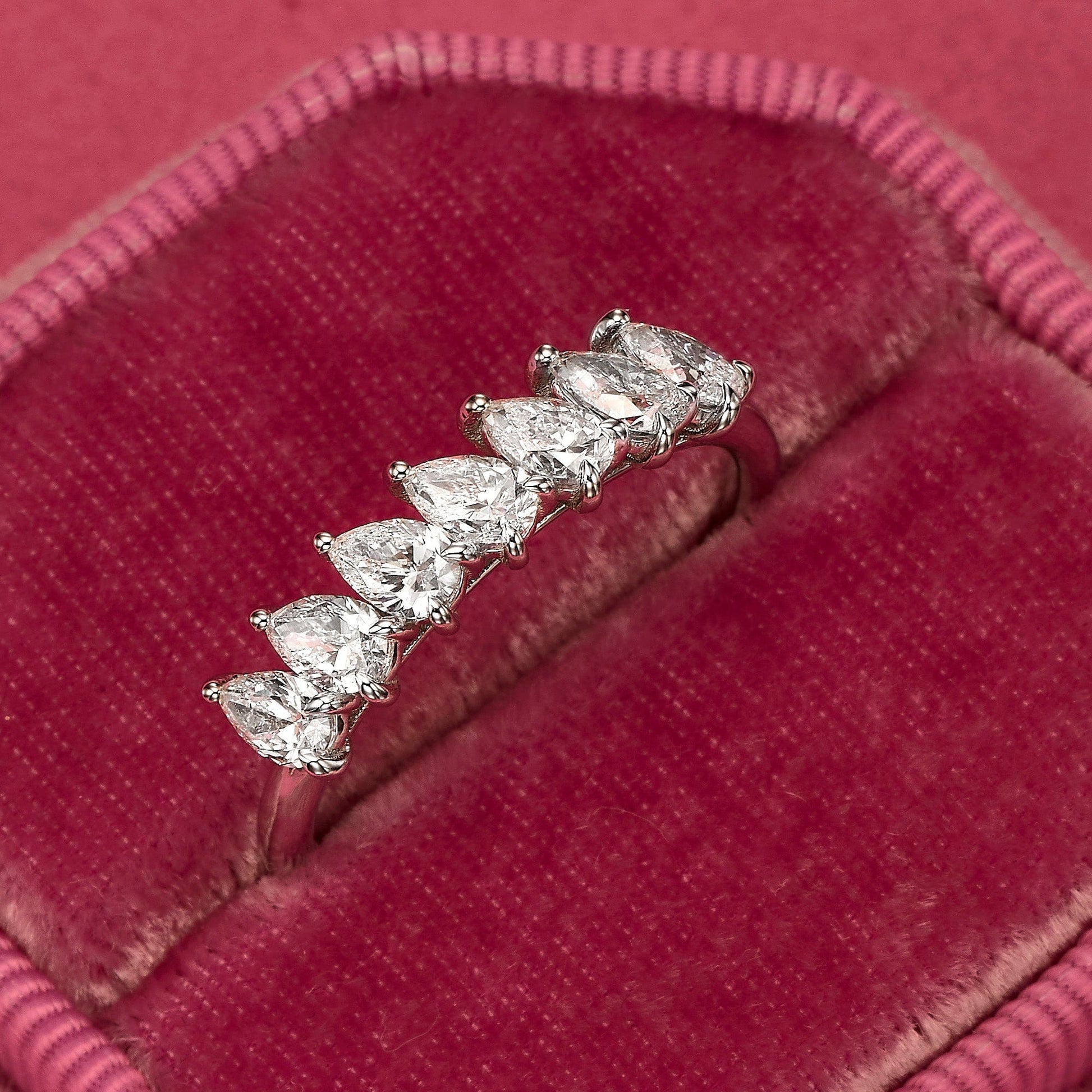 Diamond ring on red velvet.