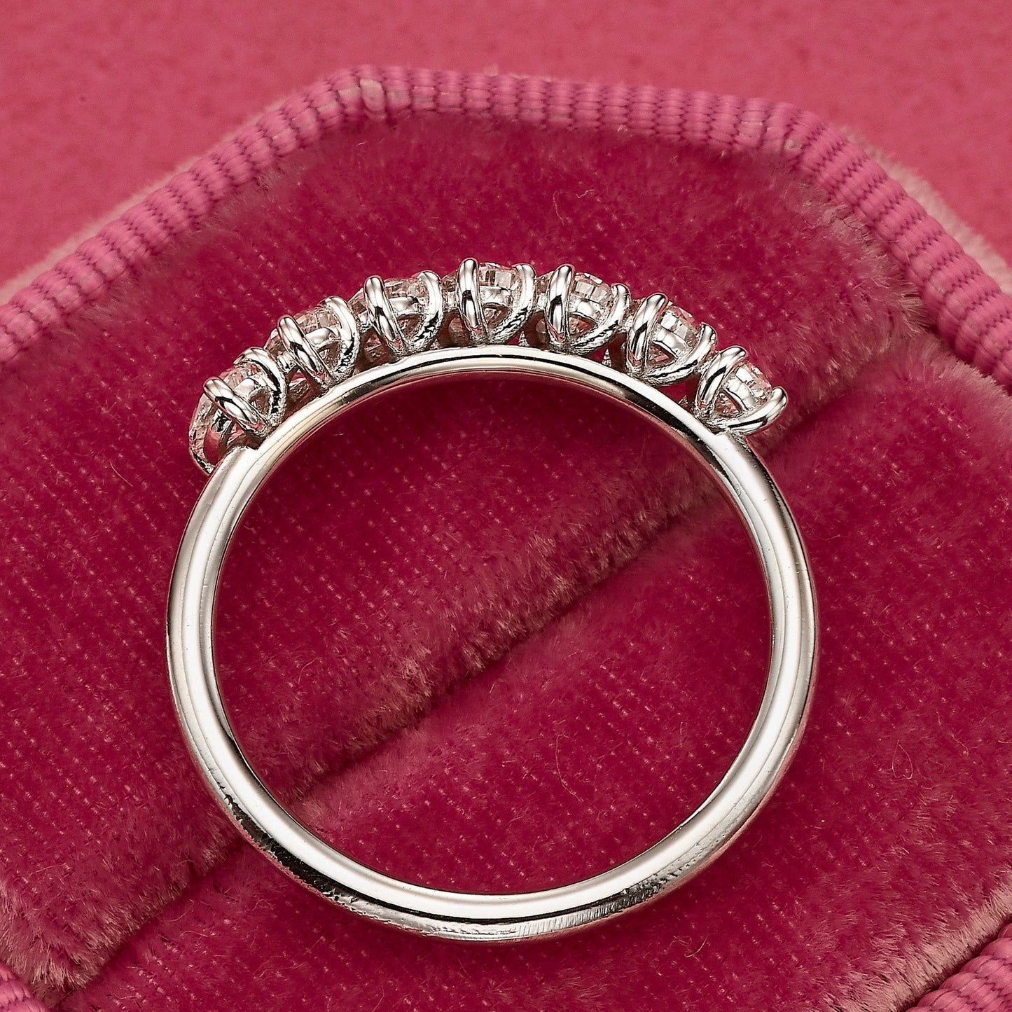 Diamond ring on pink velvet.