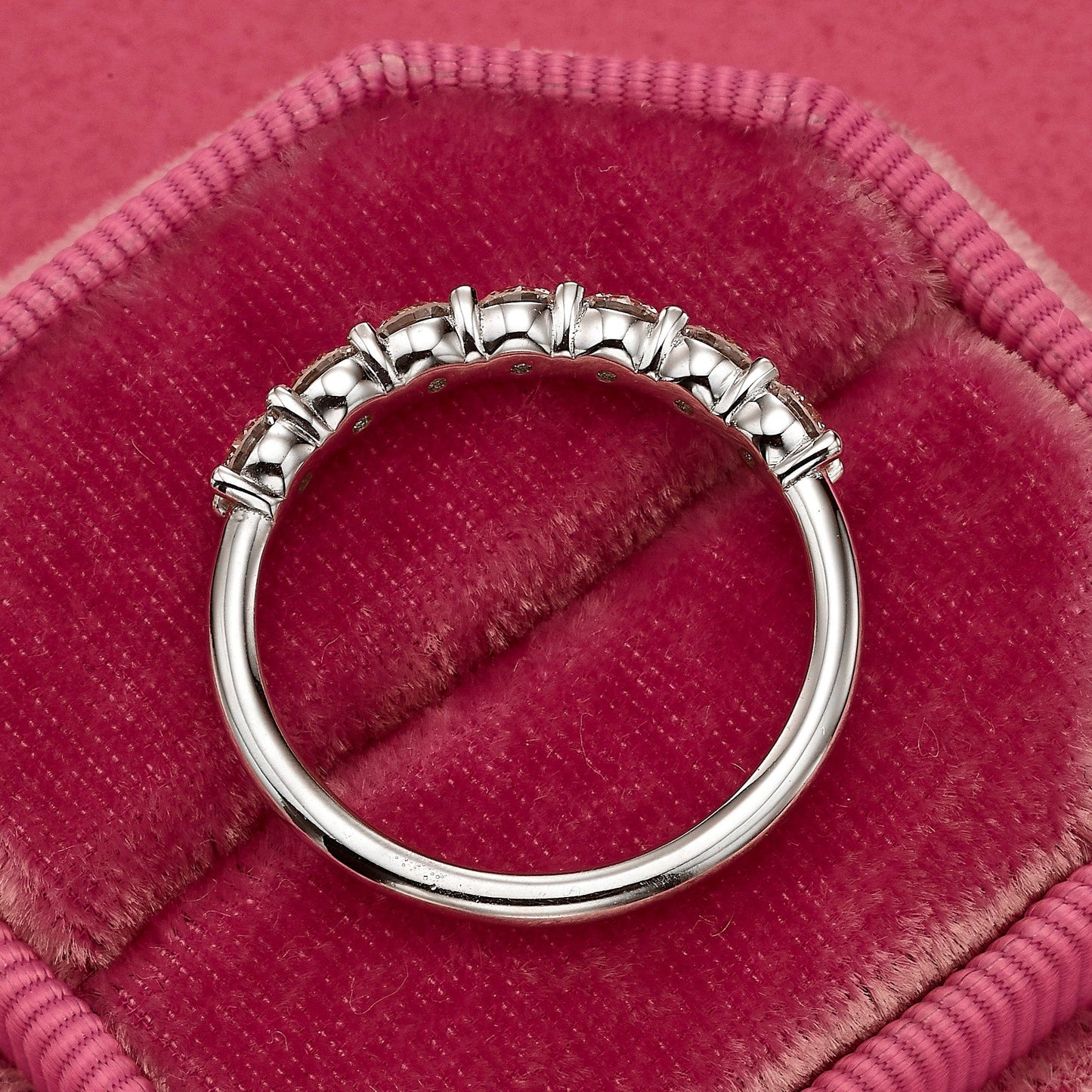 Diamond ring on pink velvet.