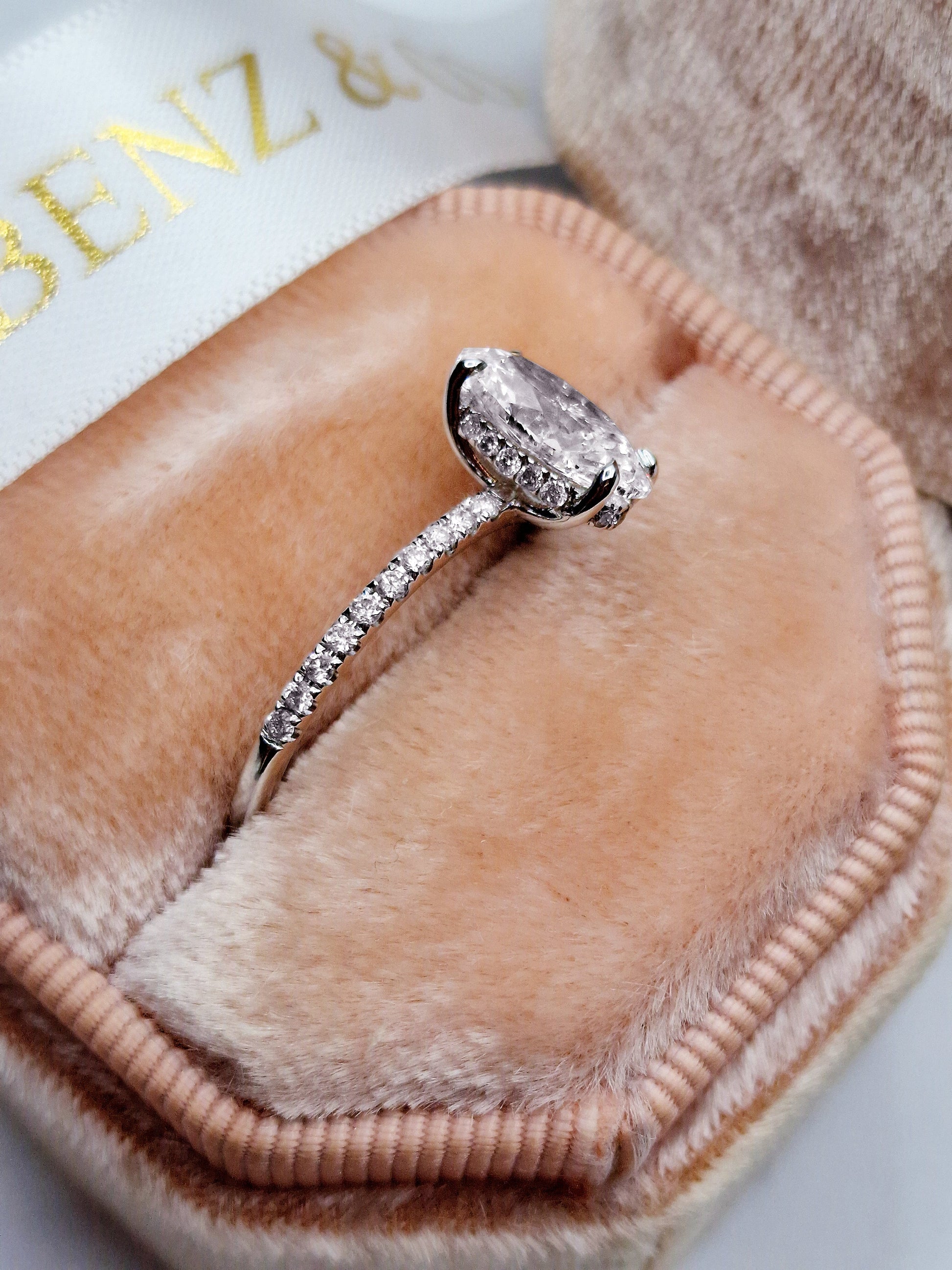 Diamond ring in a ring box.