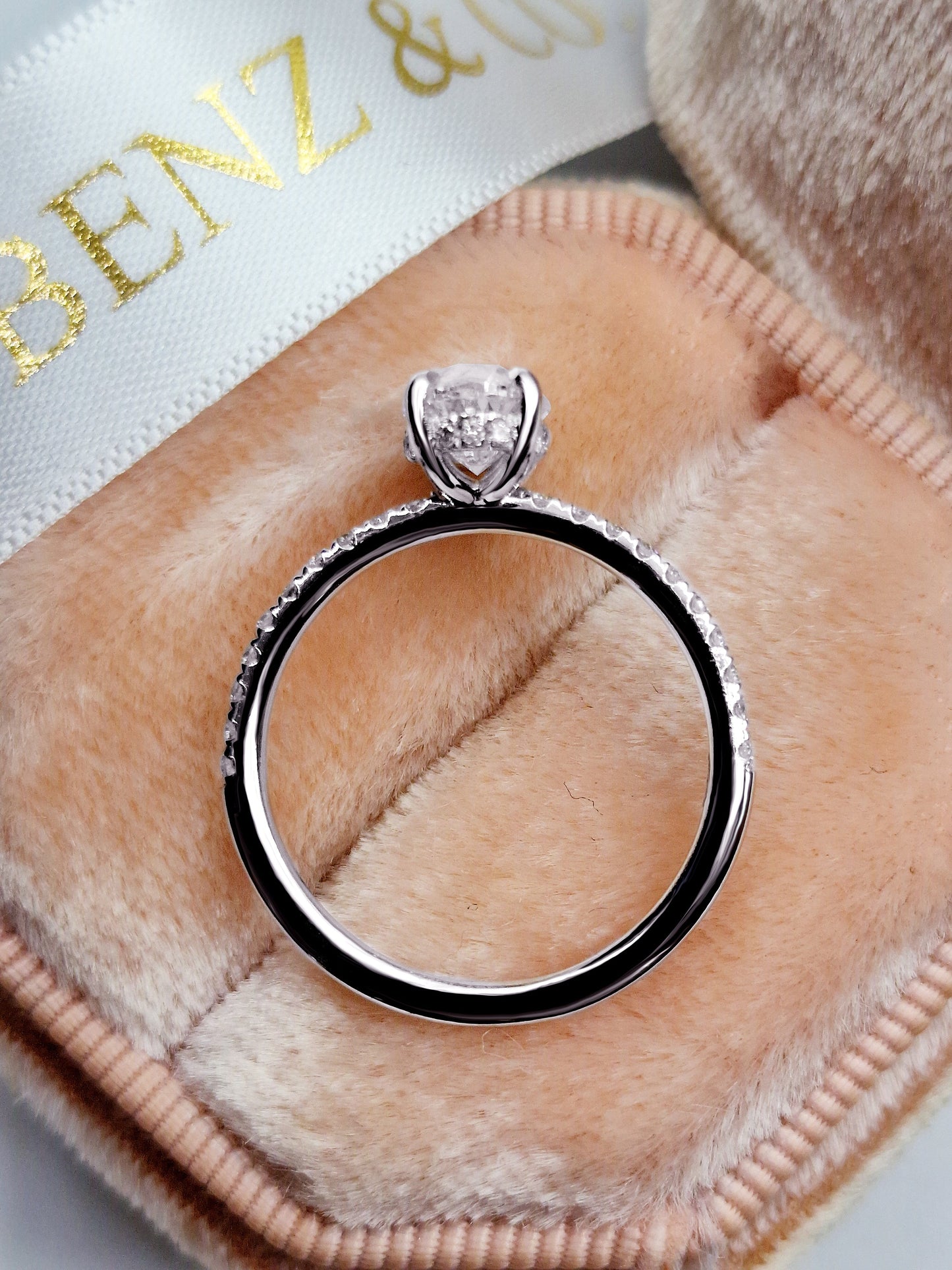 Diamond engagement ring in a velvet ring box.