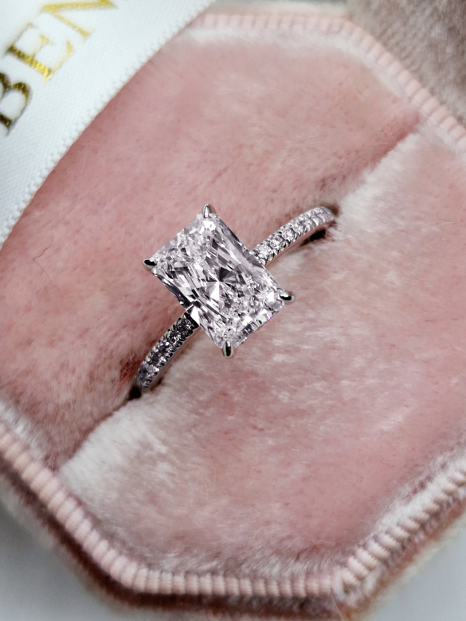 Diamond ring in a pink velvet box.