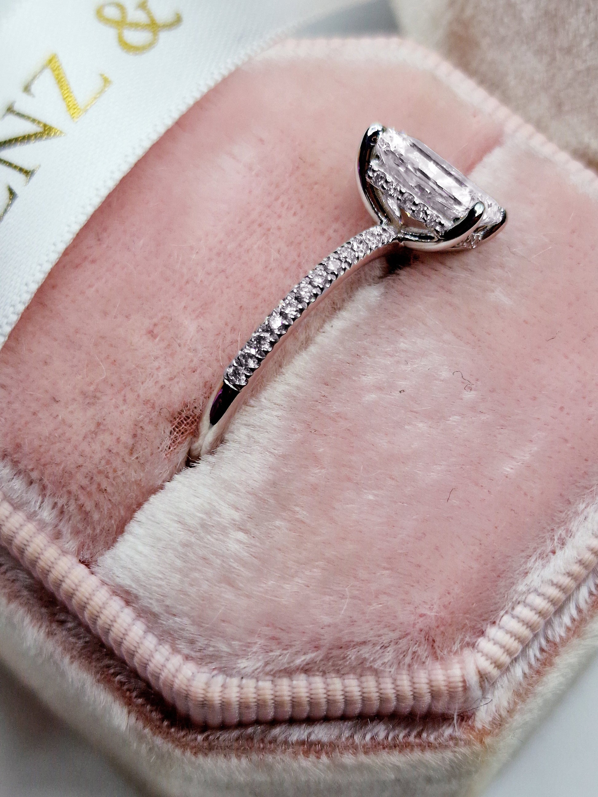 Diamond ring on pink velvet.