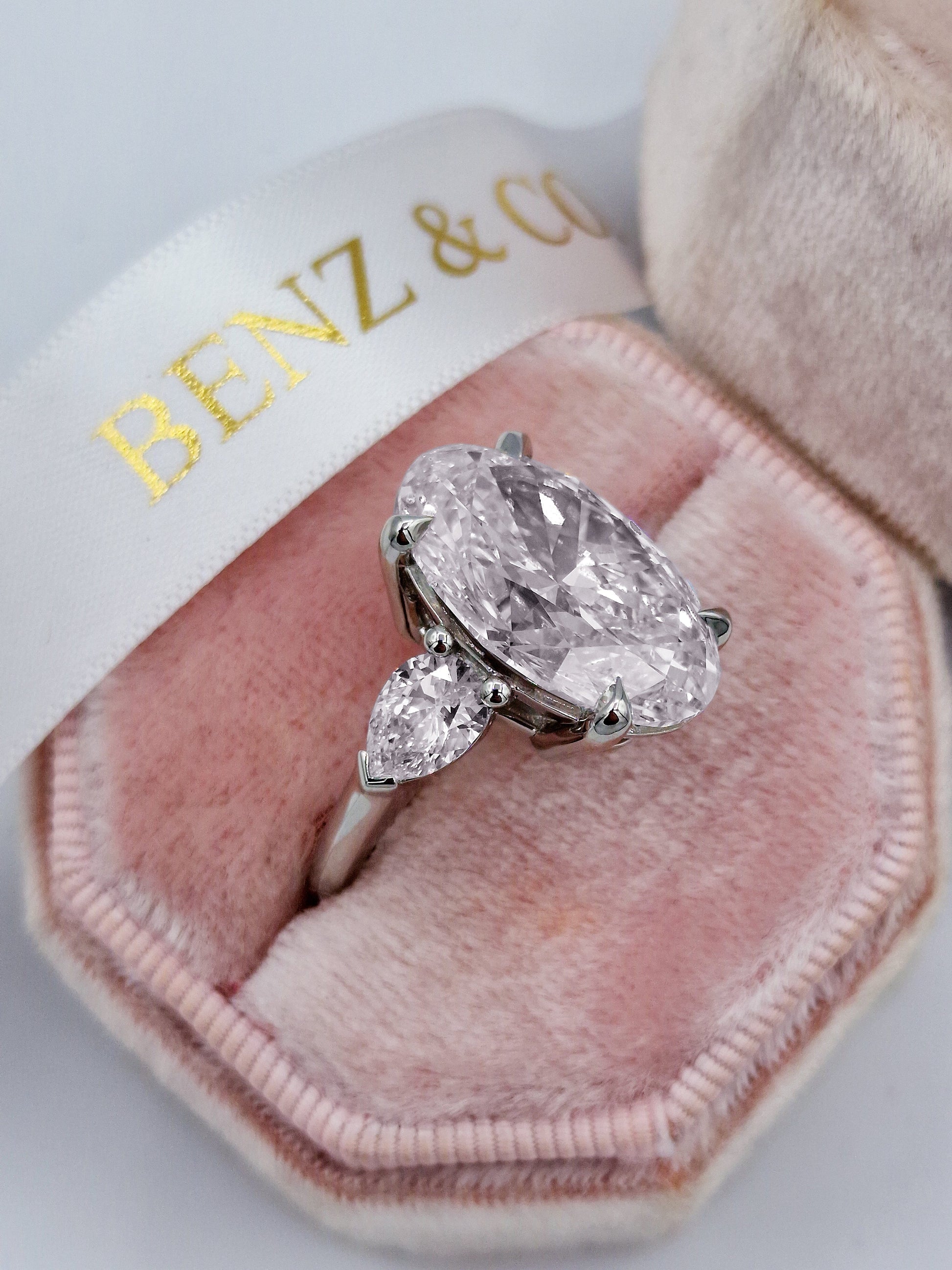 11ct Oval diamond engagement ring with pear side stones