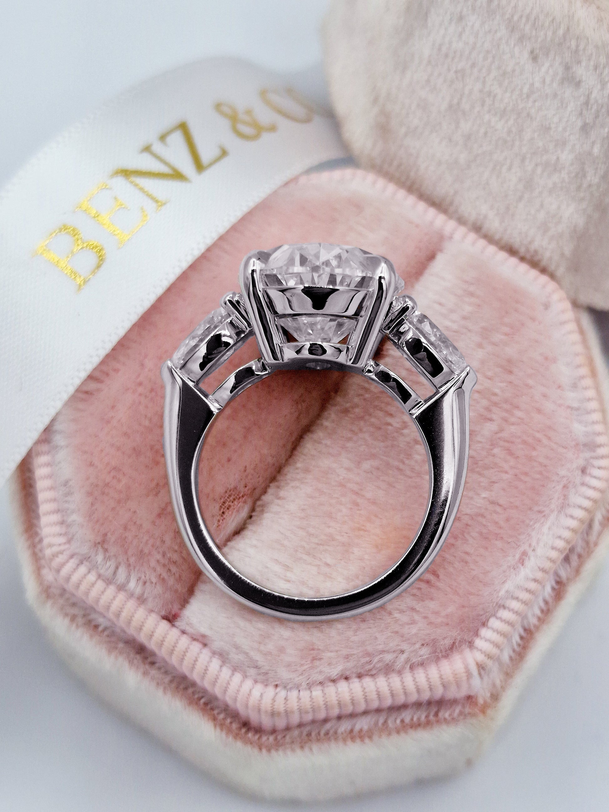 11ct Oval diamond three-stone engagement ring with pear-shaped side stones