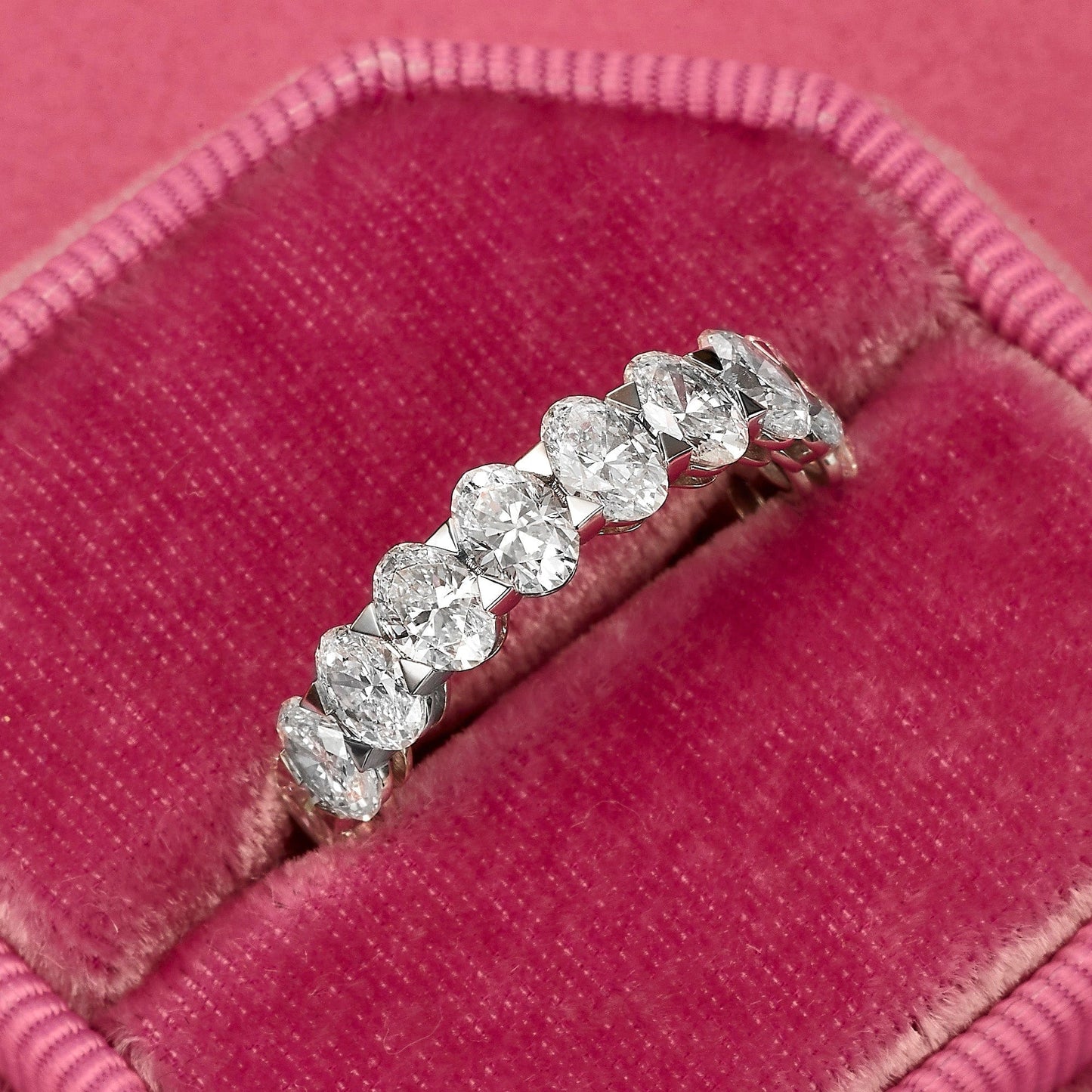 Diamond ring on pink velvet.