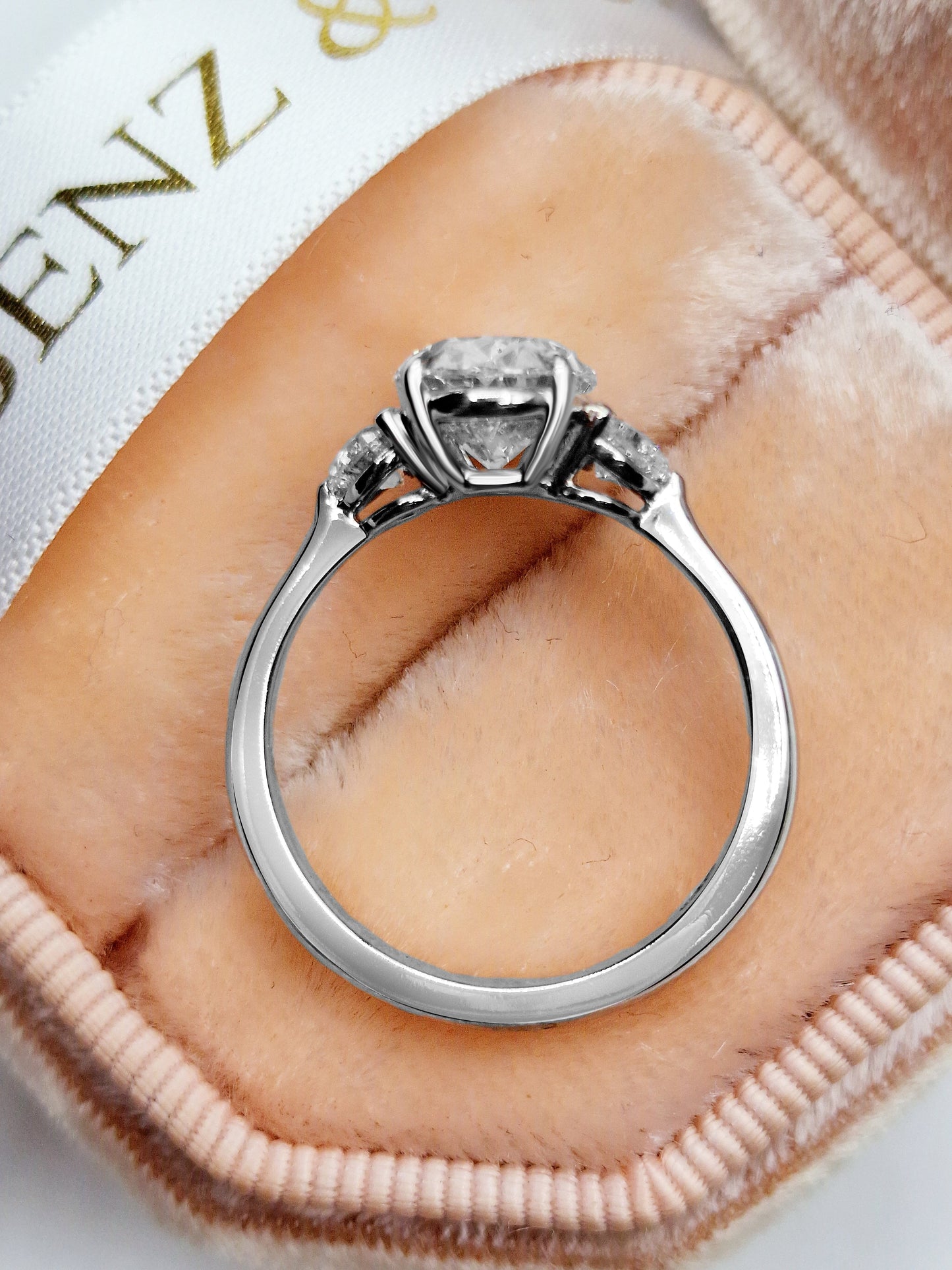 Diamond engagement ring in a velvet ring box.