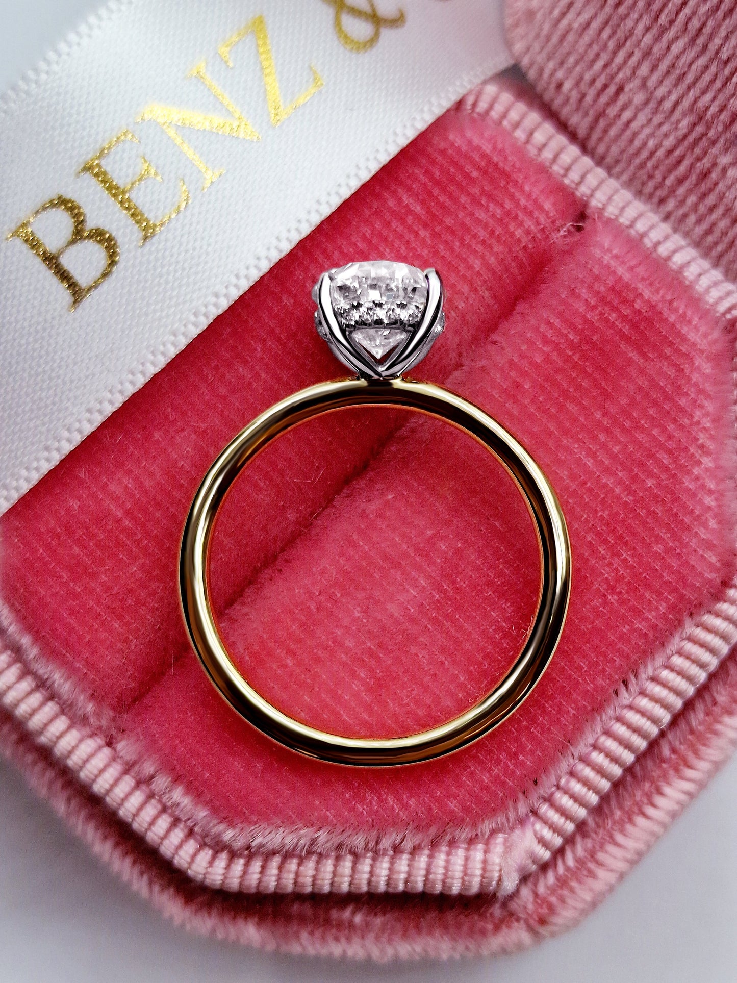 Oval diamond solitaire engagement ring in gold