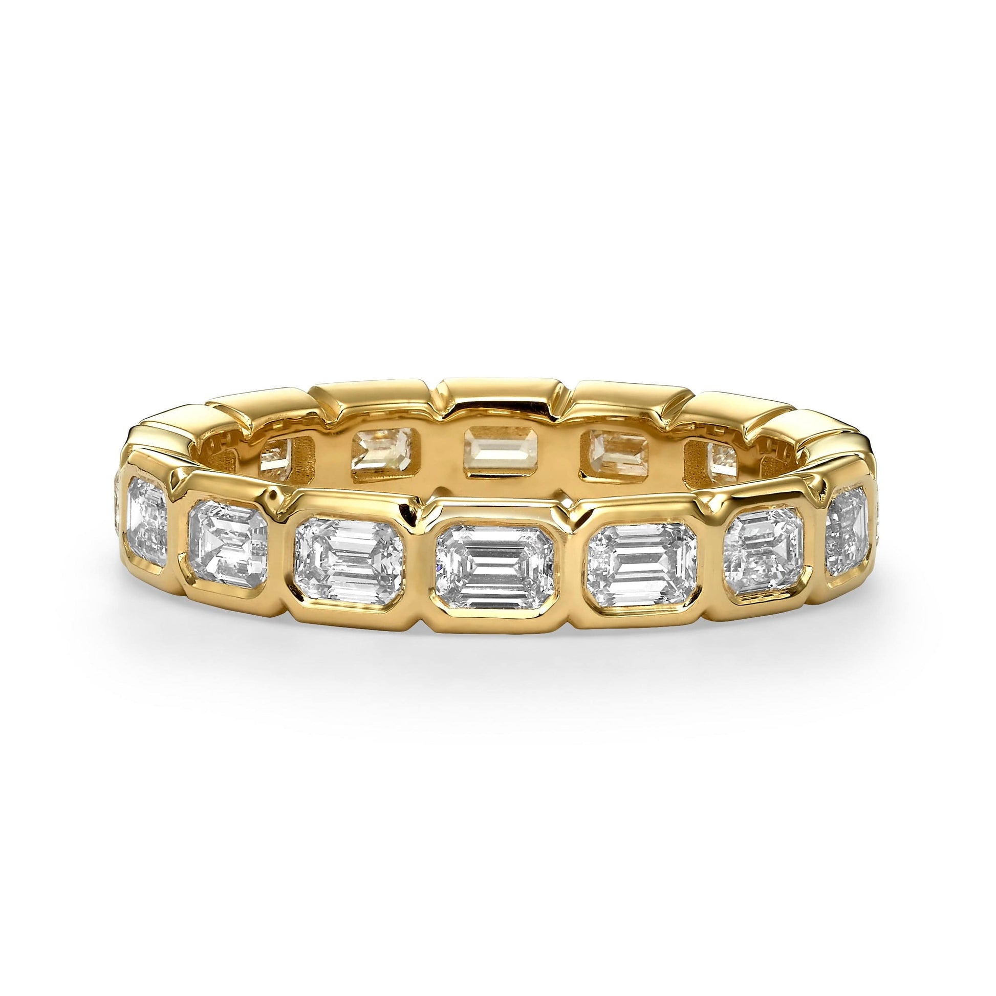 2ct emerald cut east-west bezel set diamond eternity band in yellow gold