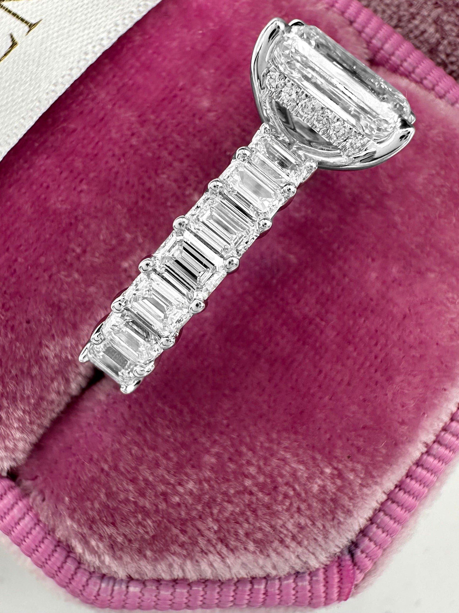 Emerald cut engagement ring with diamond eternity band