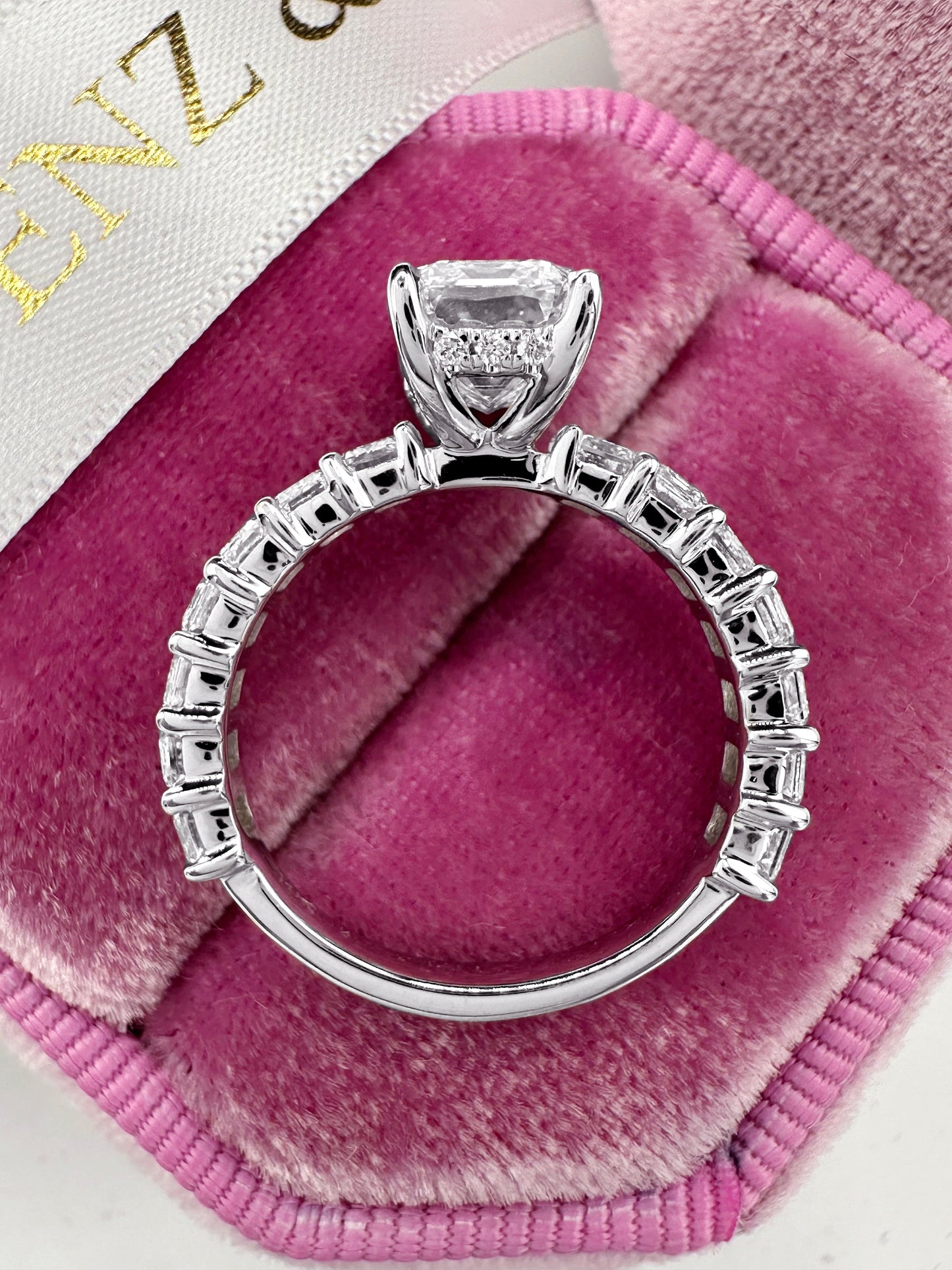 Emerald cut diamond engagement ring with eternity band.