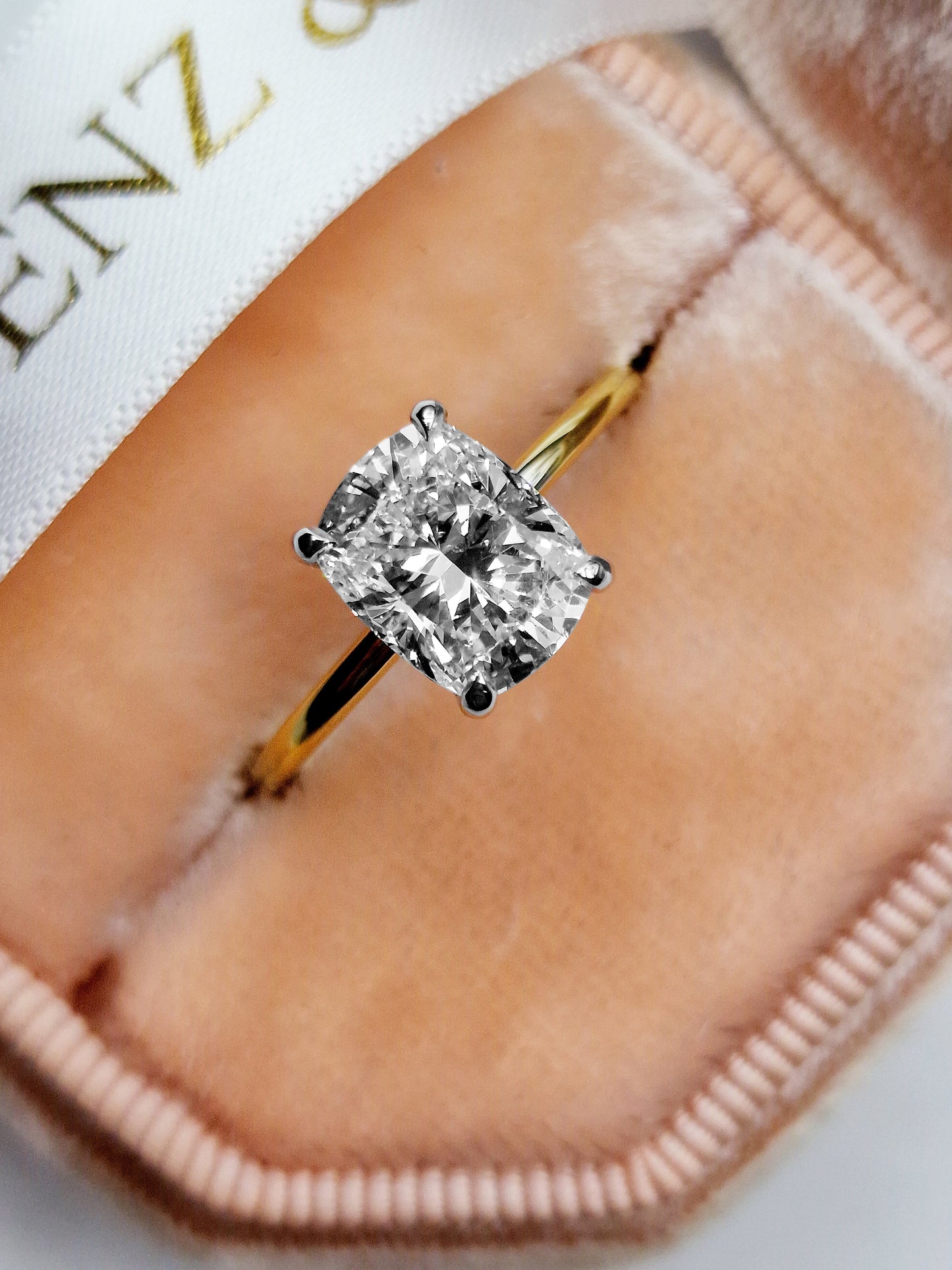 Elongated cushion cut diamond engagement ring in yellow gold