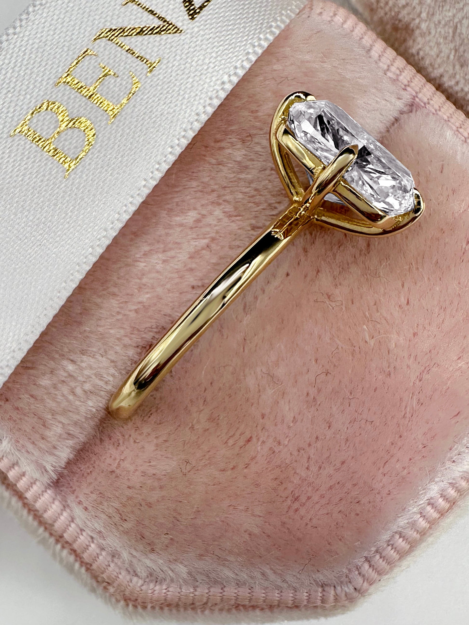 Elongated cushion cut diamond ring in yellow gold