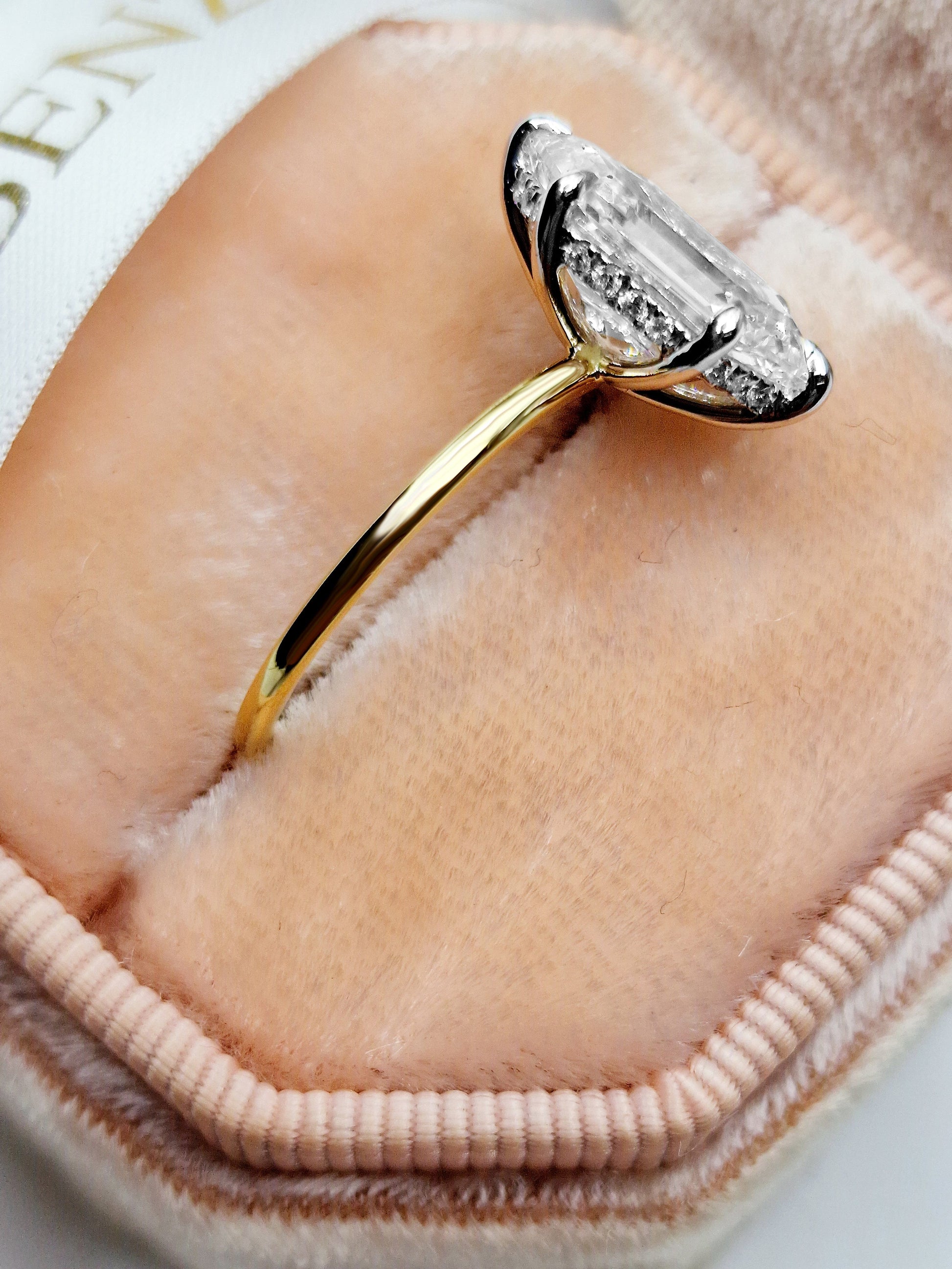 Elongated hexagon diamond engagement ring in yellow gold