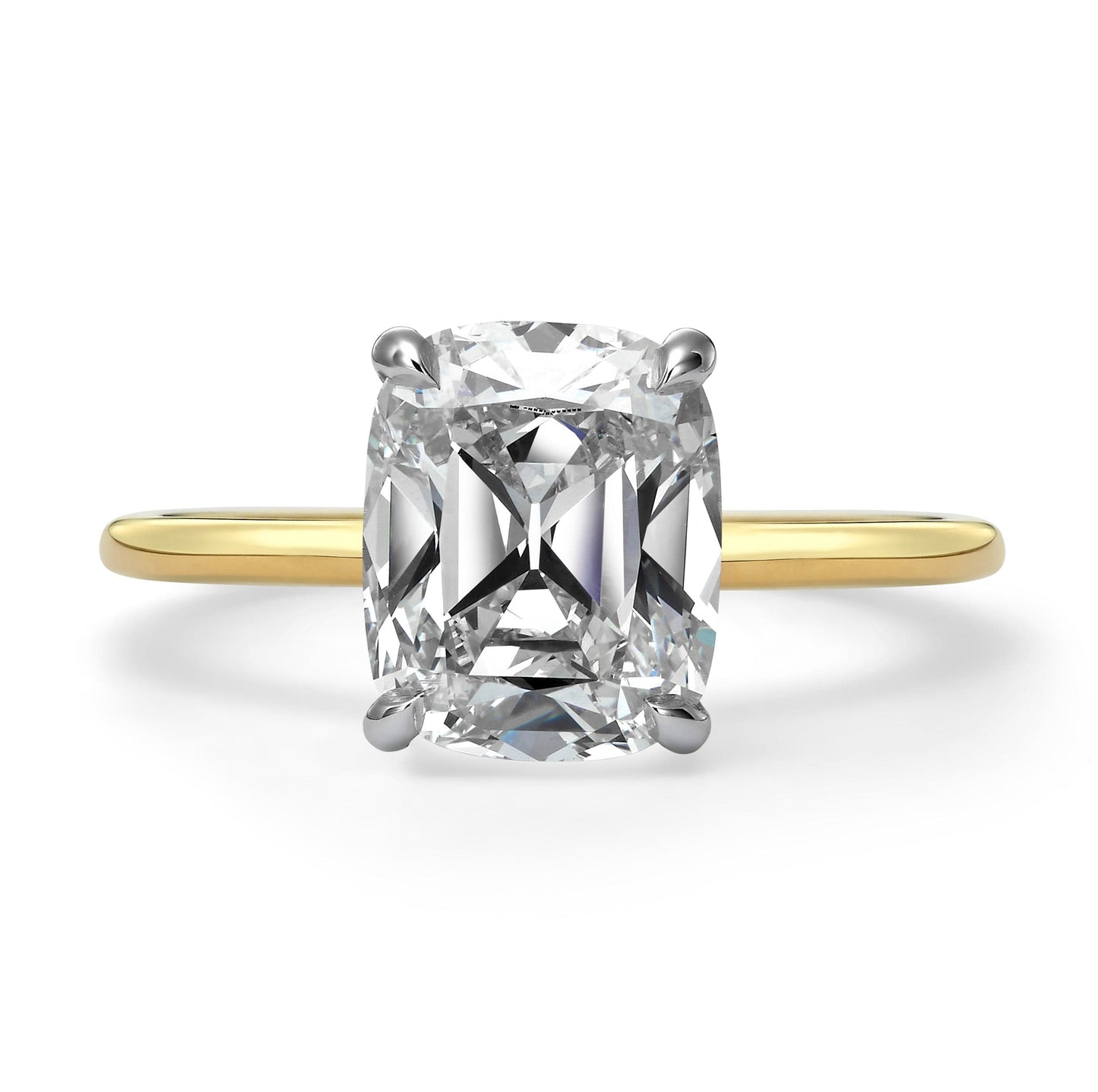 Elongated cushion cut diamond solitaire engagement ring in yellow gold
