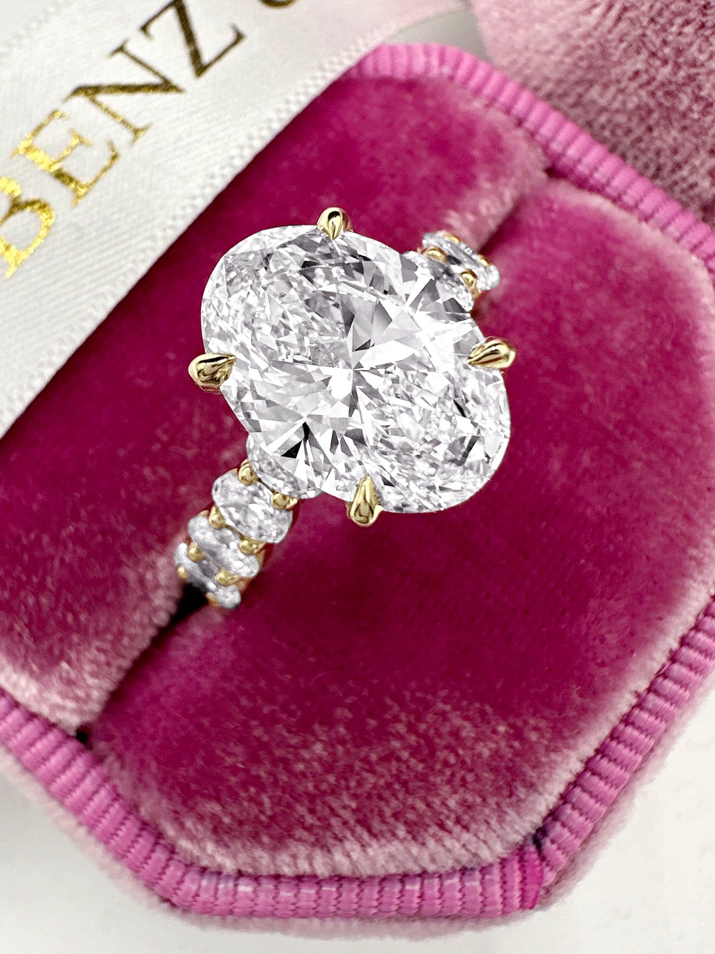 3ct Oval lab grown diamond ring with side diamonds and hidden halo in yellow...