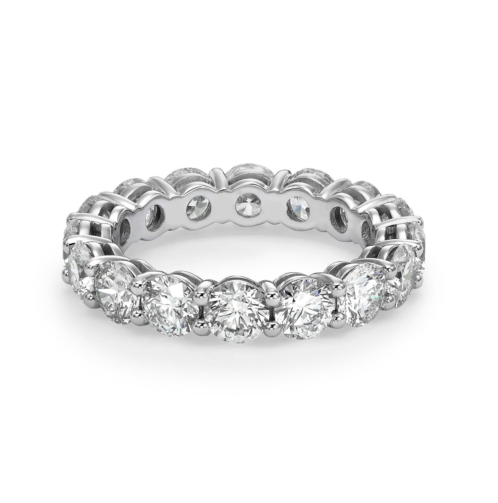 Diamond eternity ring on white background.