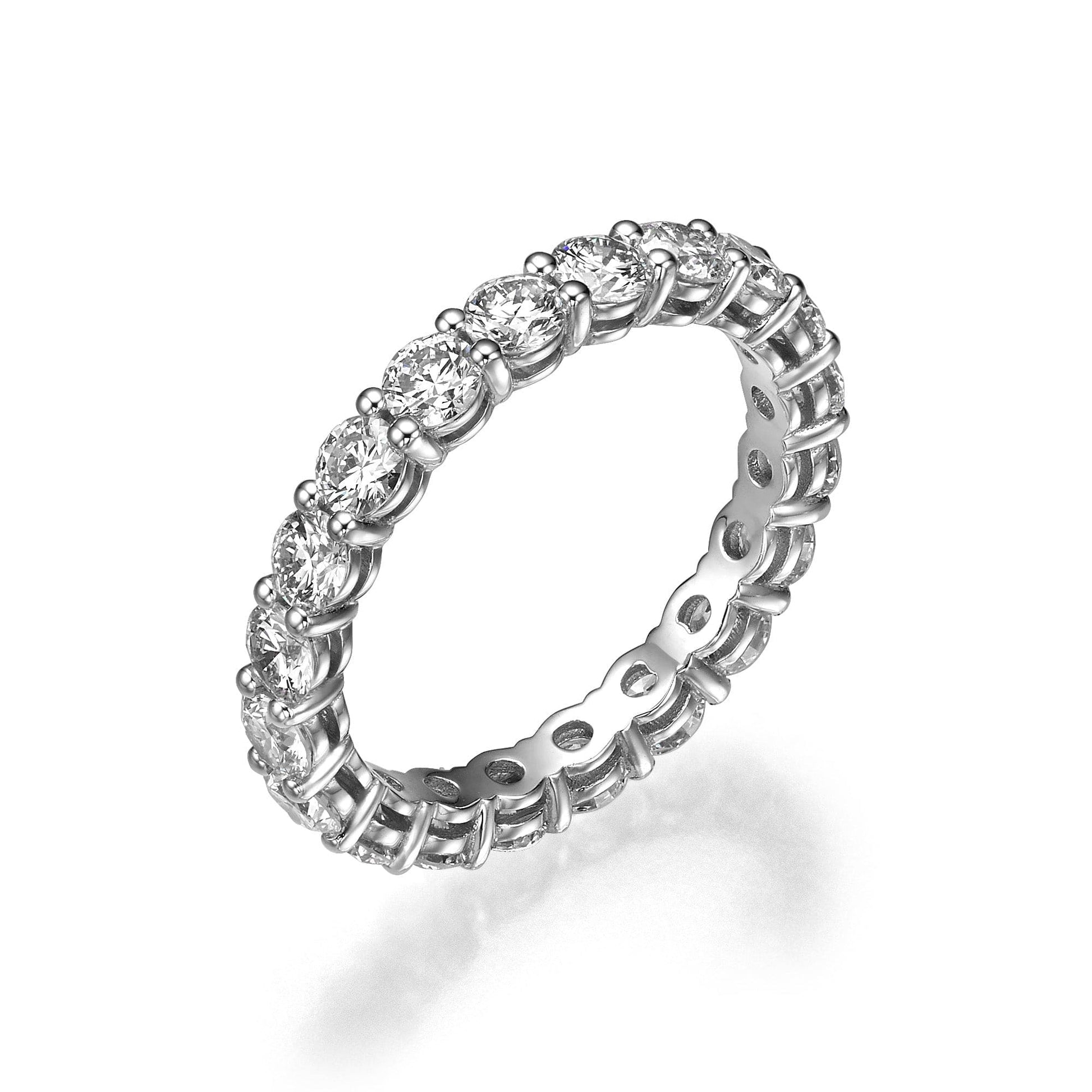 Diamond eternity ring on white background.