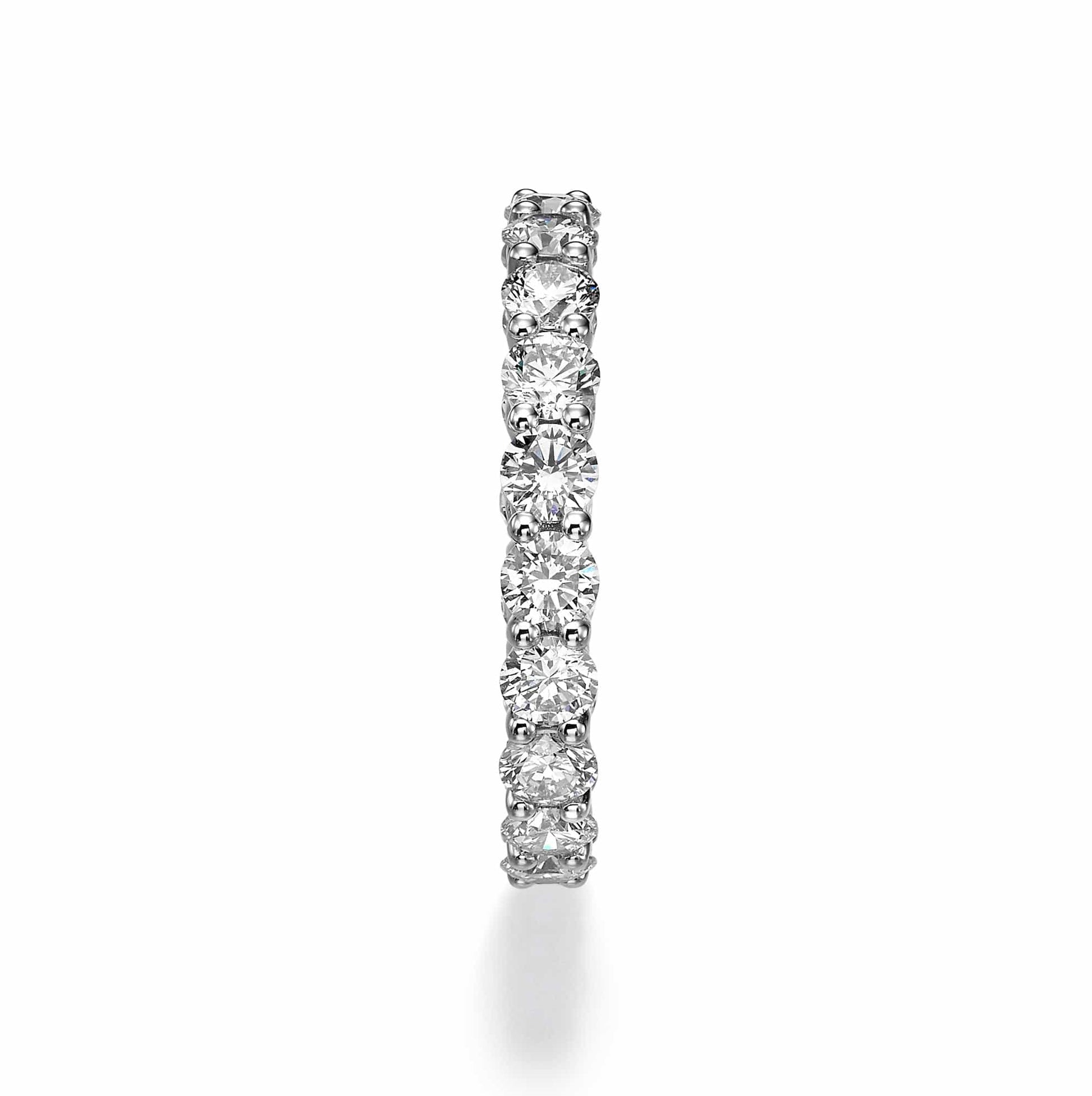 Diamond eternity ring on white background.