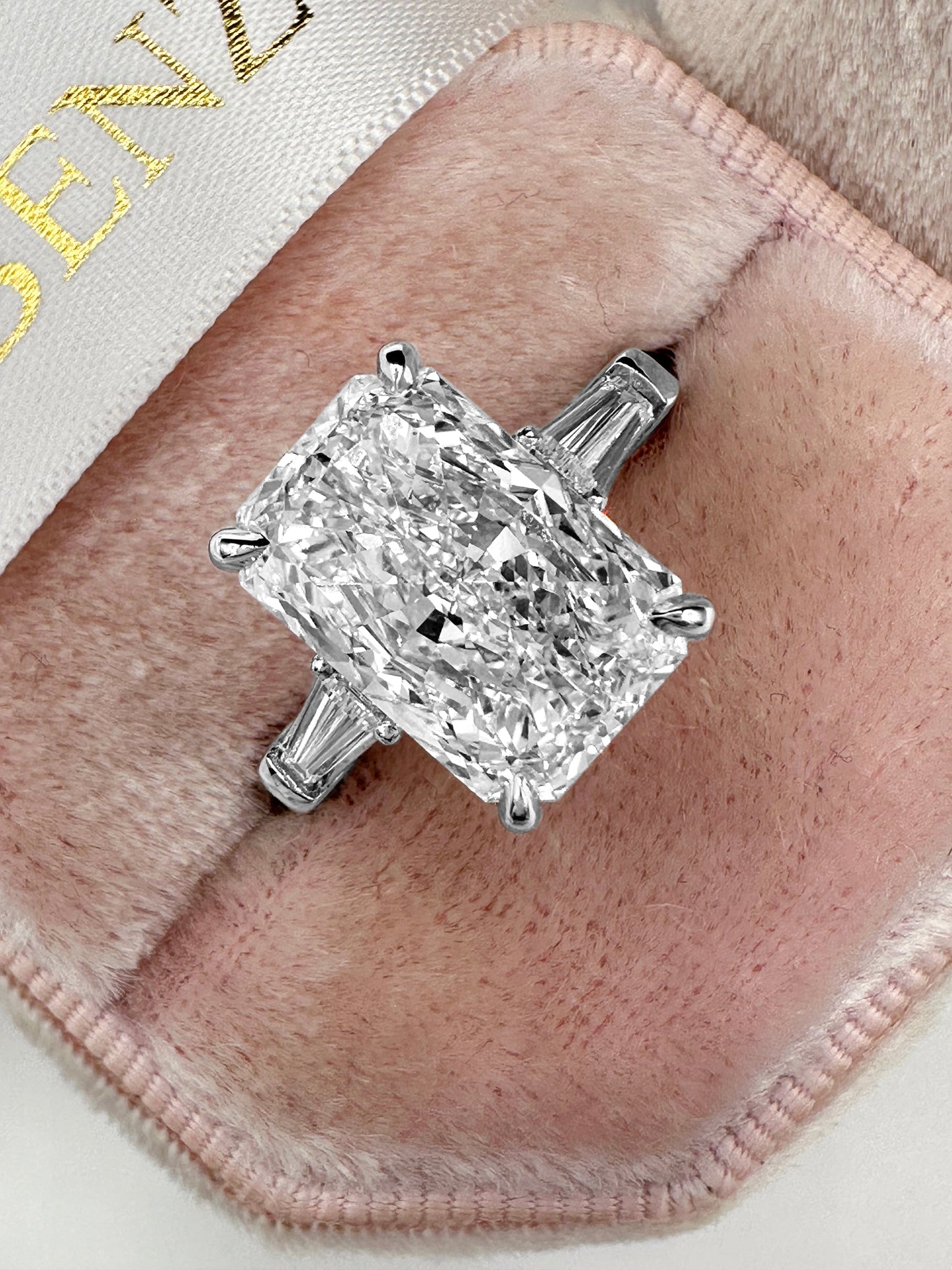 Elongated radiant cut lab grown diamond ring with tapered baguettes