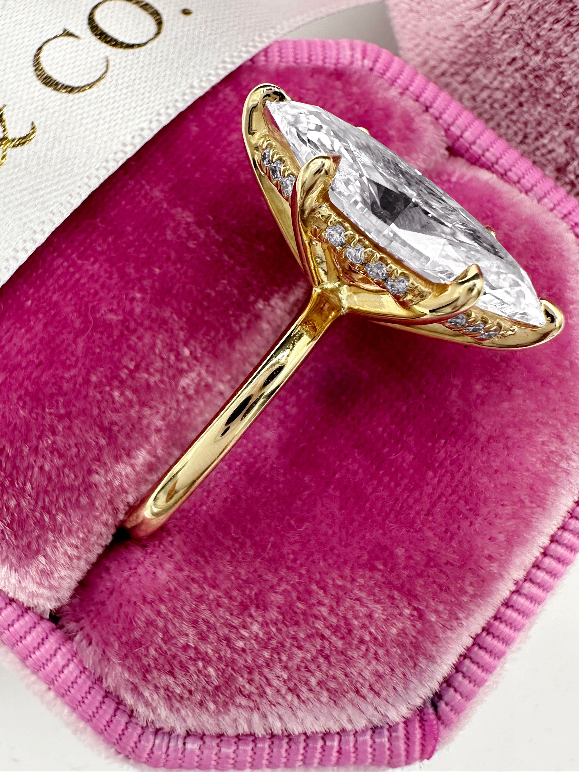 5ct Marquise lab diamond hidden halo engagement ring in yellow gold