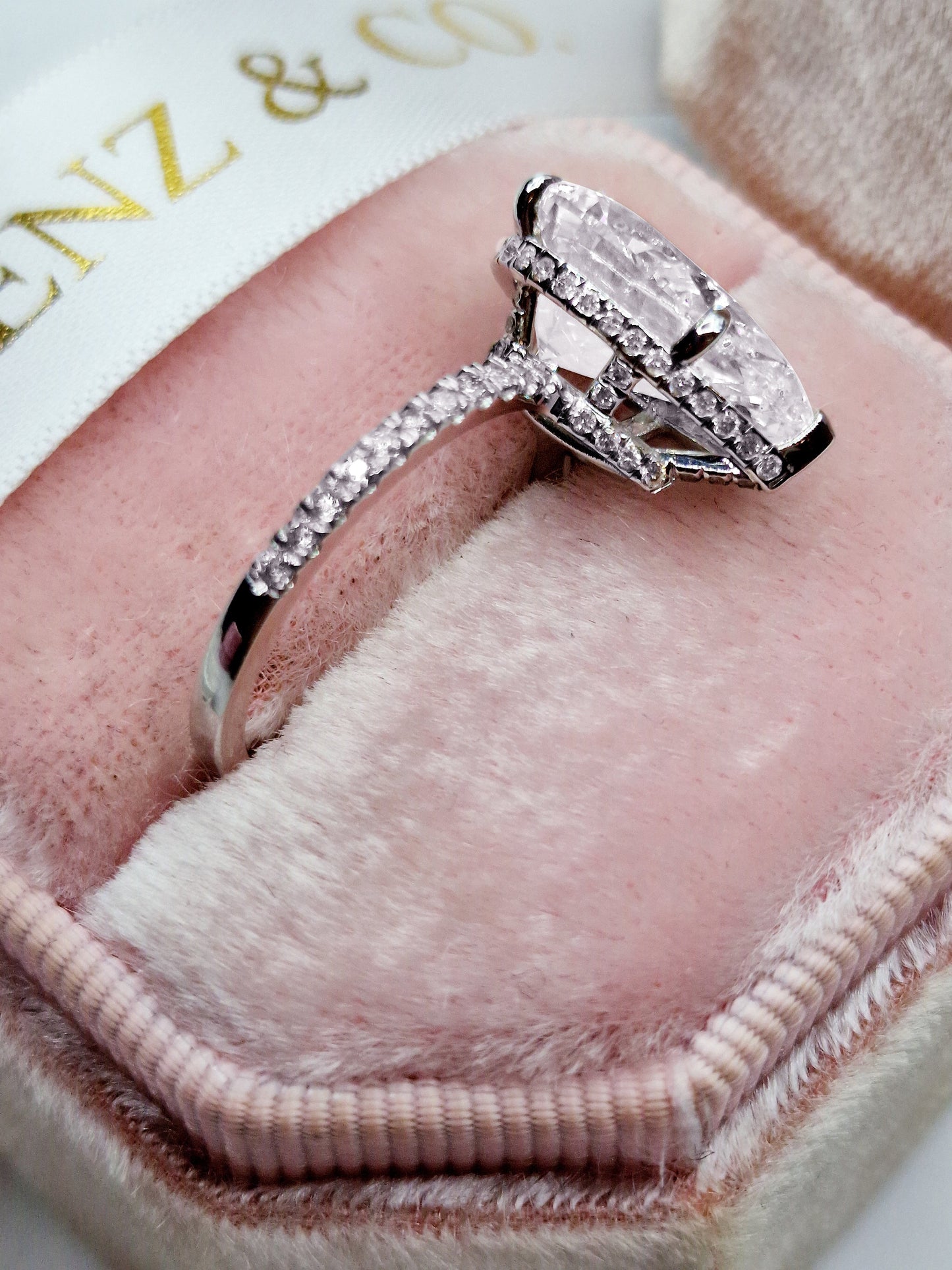 5ct pear-shaped diamond engagement ring in white gold with hidden halo