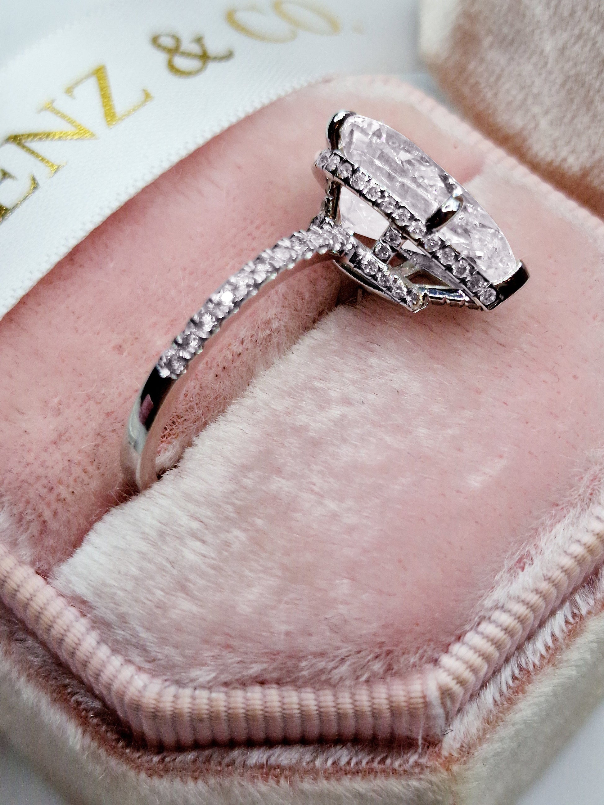 5ct pear-shaped diamond engagement ring in white gold with hidden halo