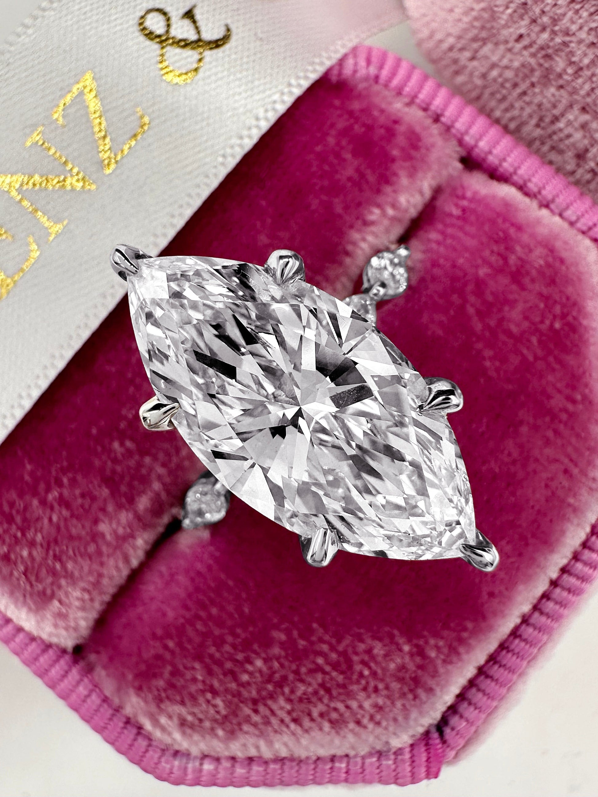 5ct Marquise cut lab diamond ring with side stones & hidden halo