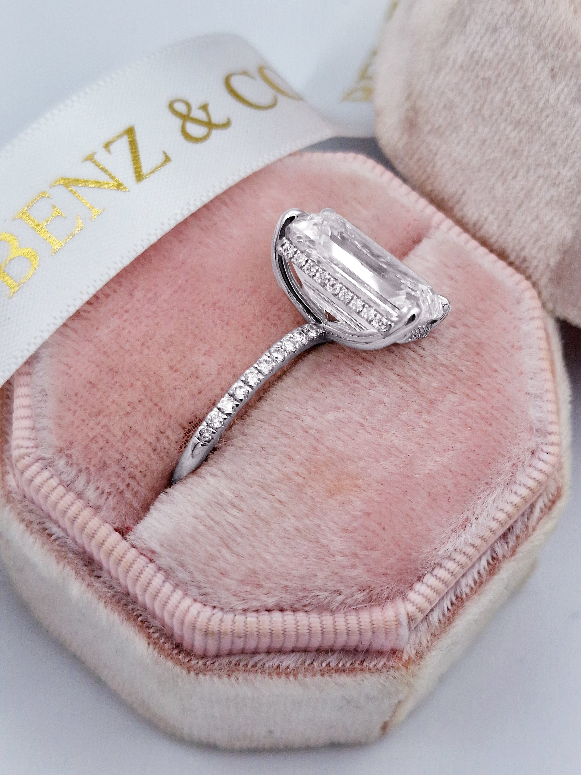 Diamond ring in a pink velvet box.