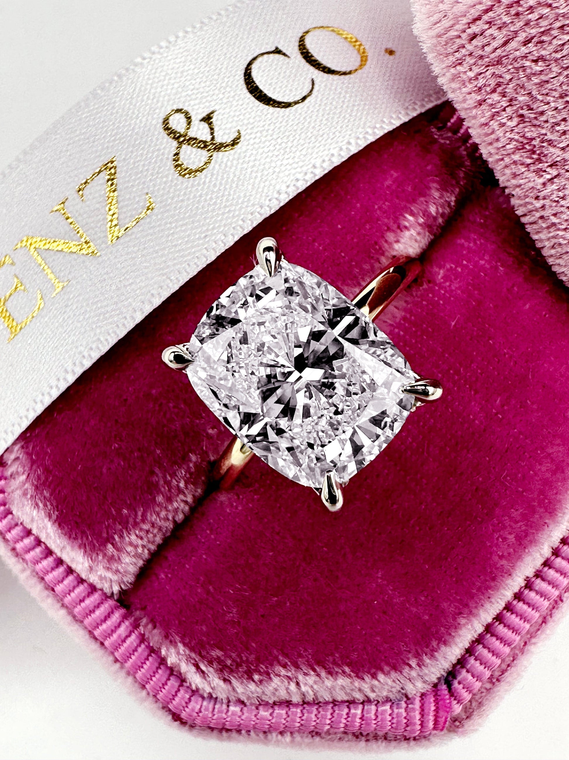 Diamond ring in a pink velvet box.