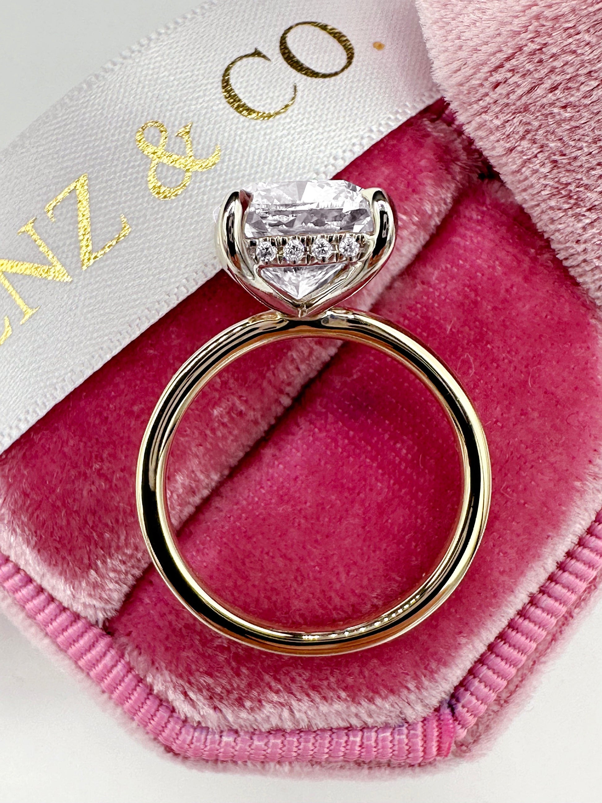 Diamond ring on pink velvet.
