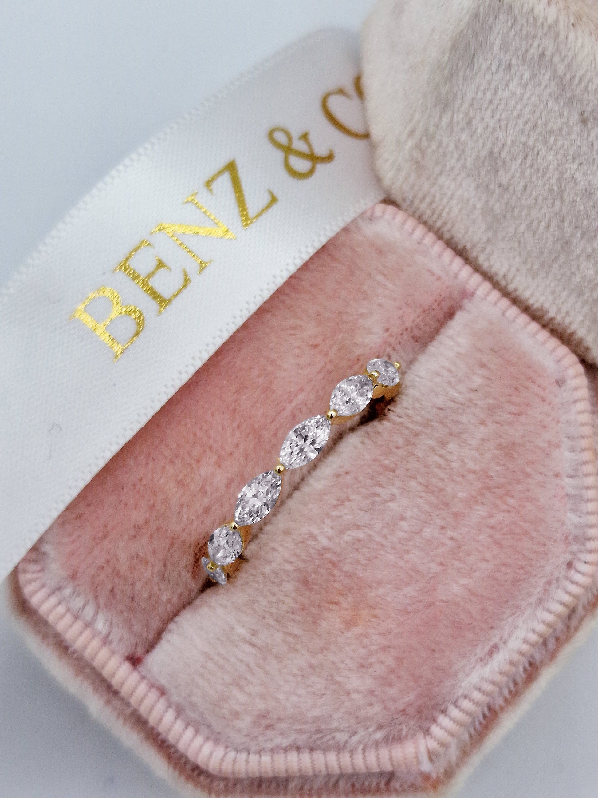 Marquise cut diamond eternity ring in yellow gold