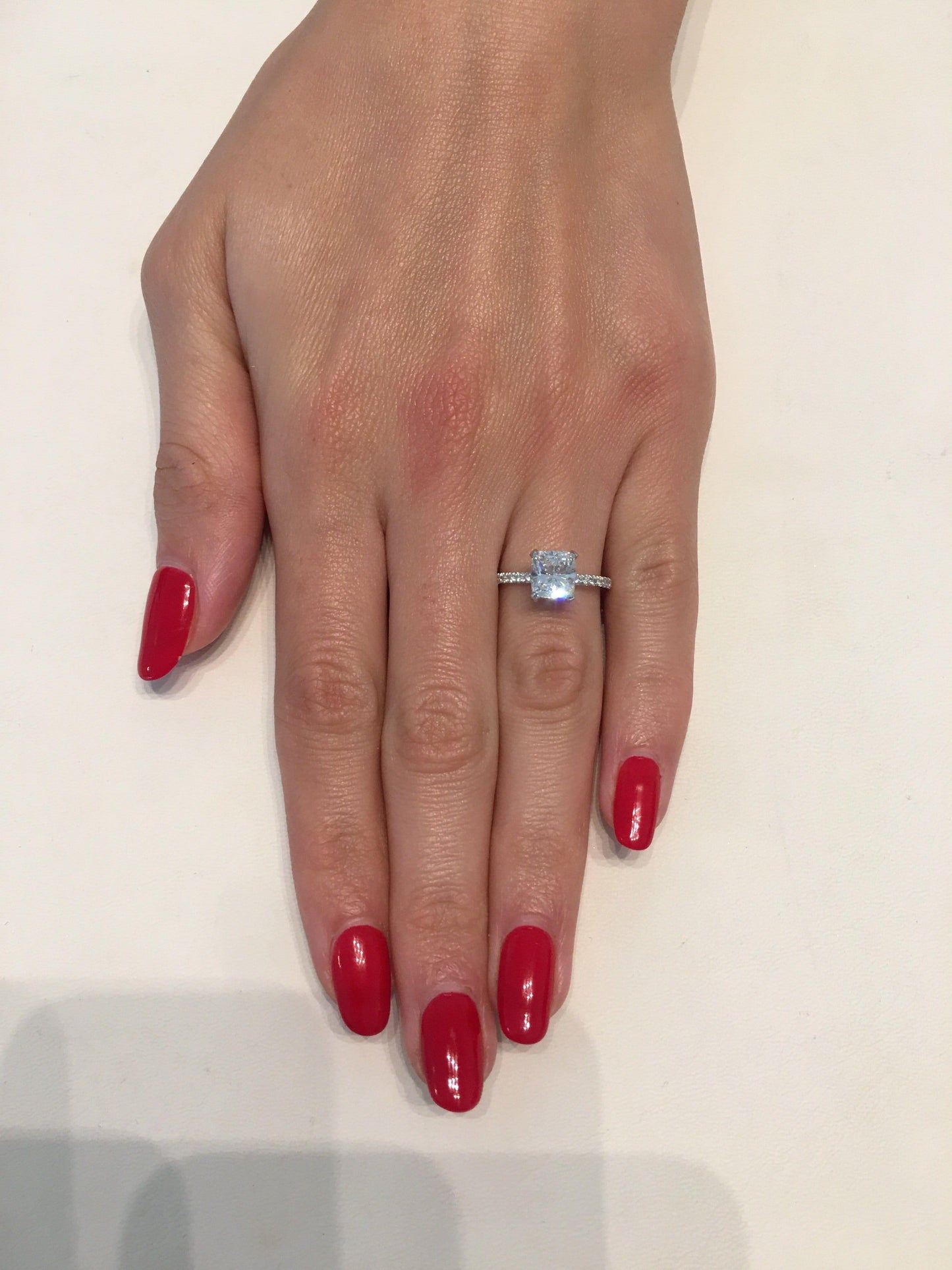 N1413 ring on hand with red nails