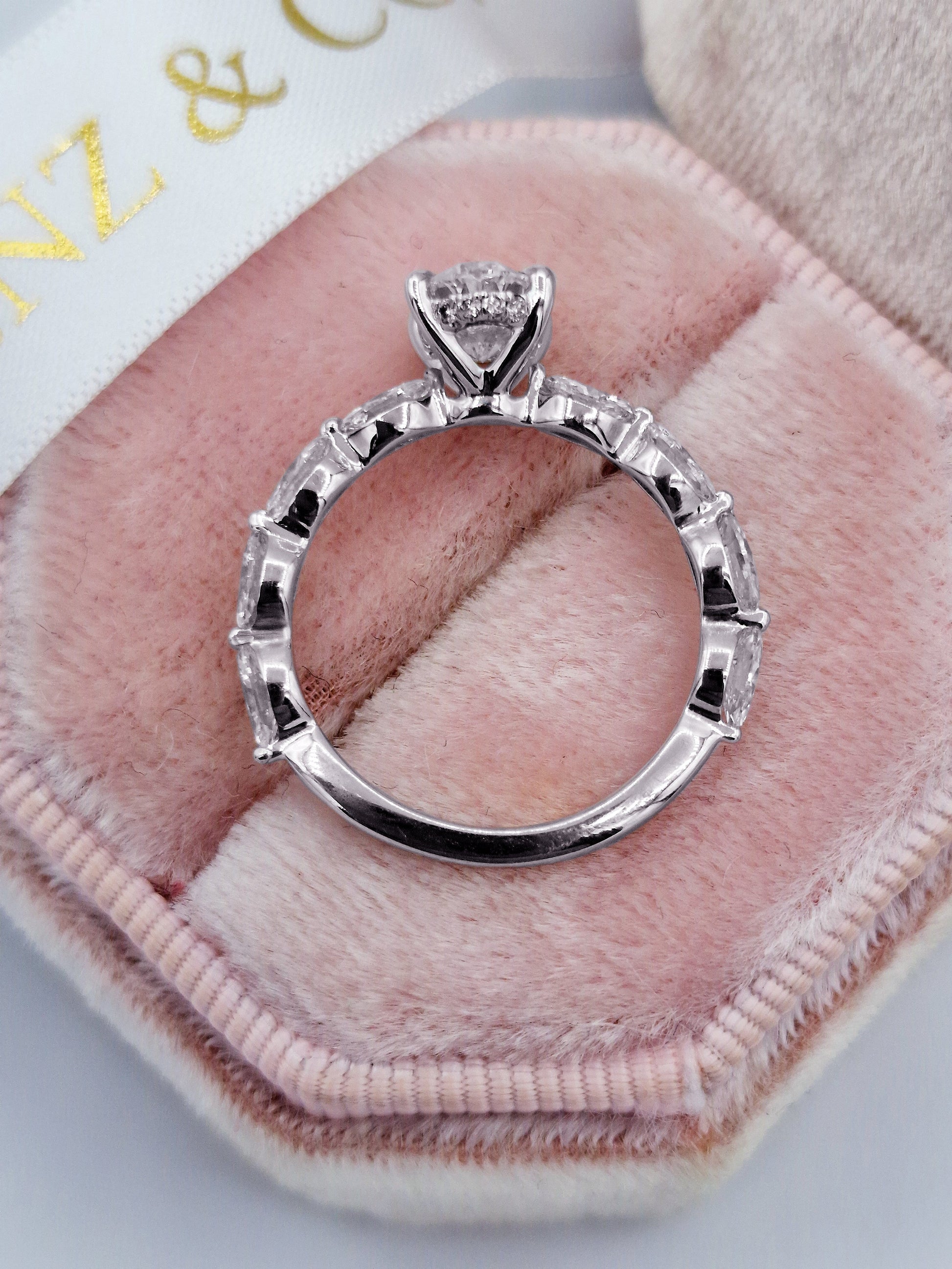 Oval diamond engagement ring with marquise side stones