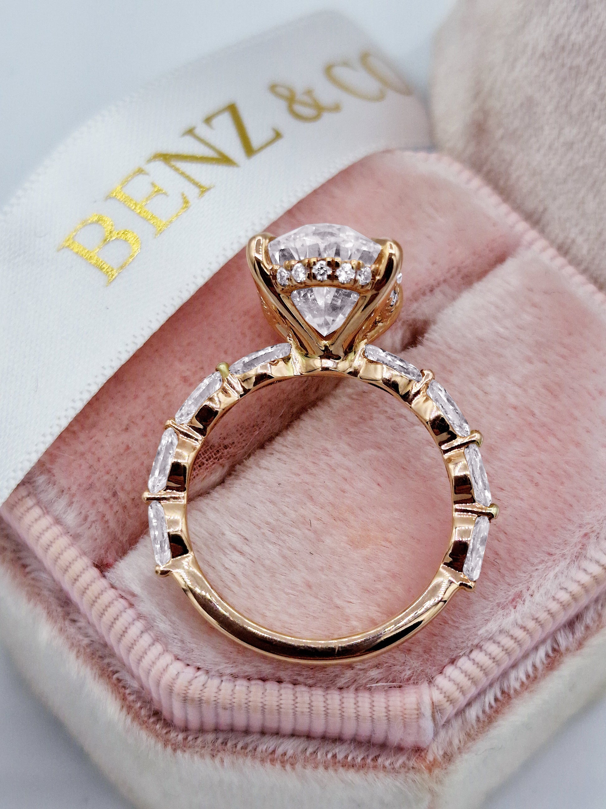 Oval diamond engagement ring with marquise cut side stones