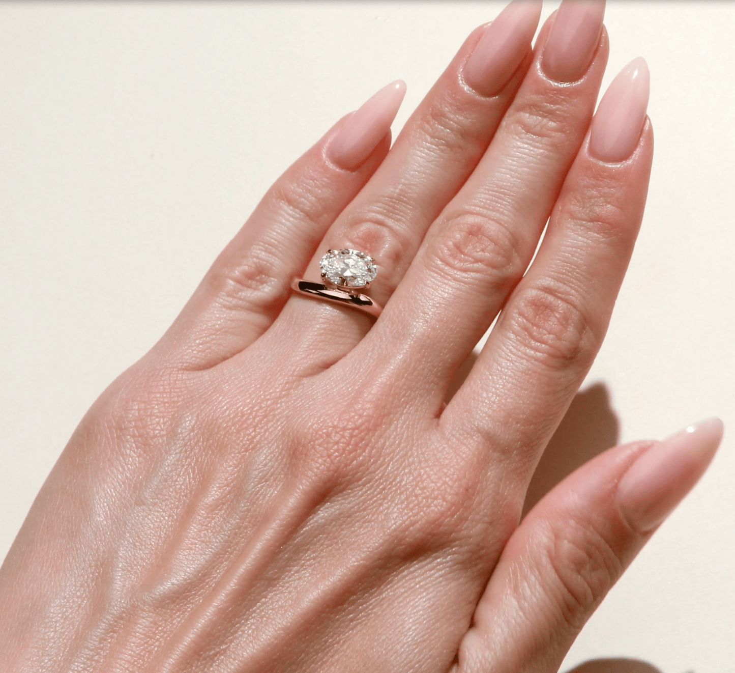 Oval cut diamond solitaire engagement ring in yellow gold