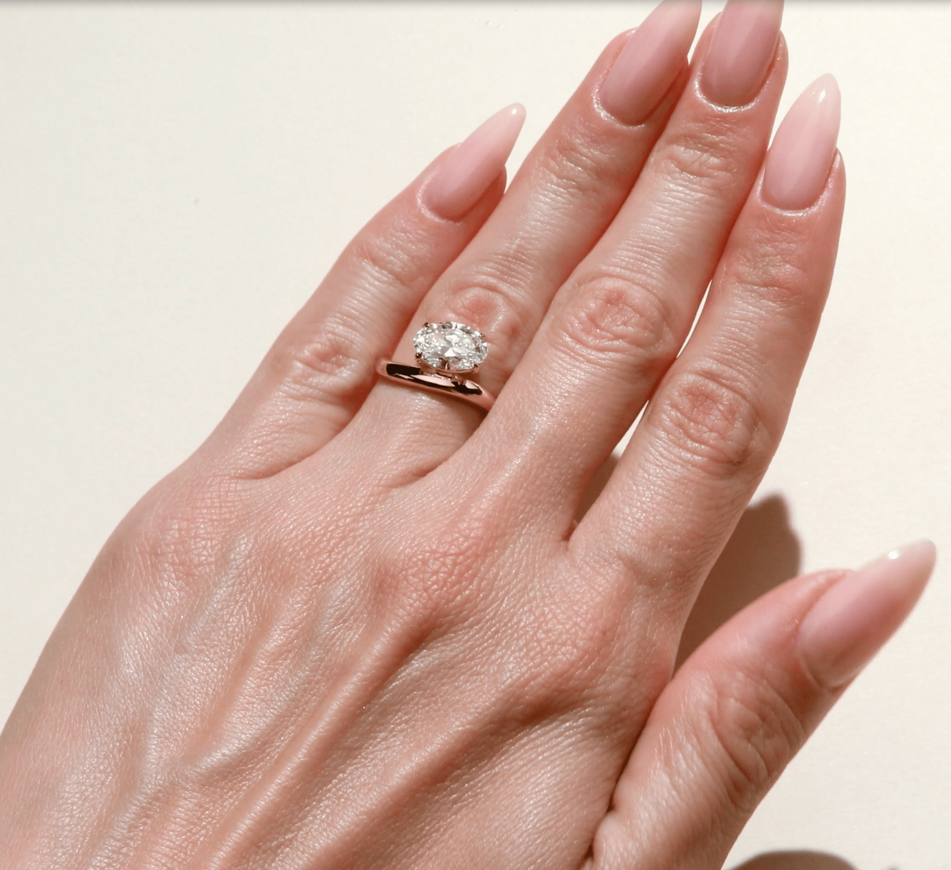 Oval cut diamond solitaire engagement ring in yellow gold