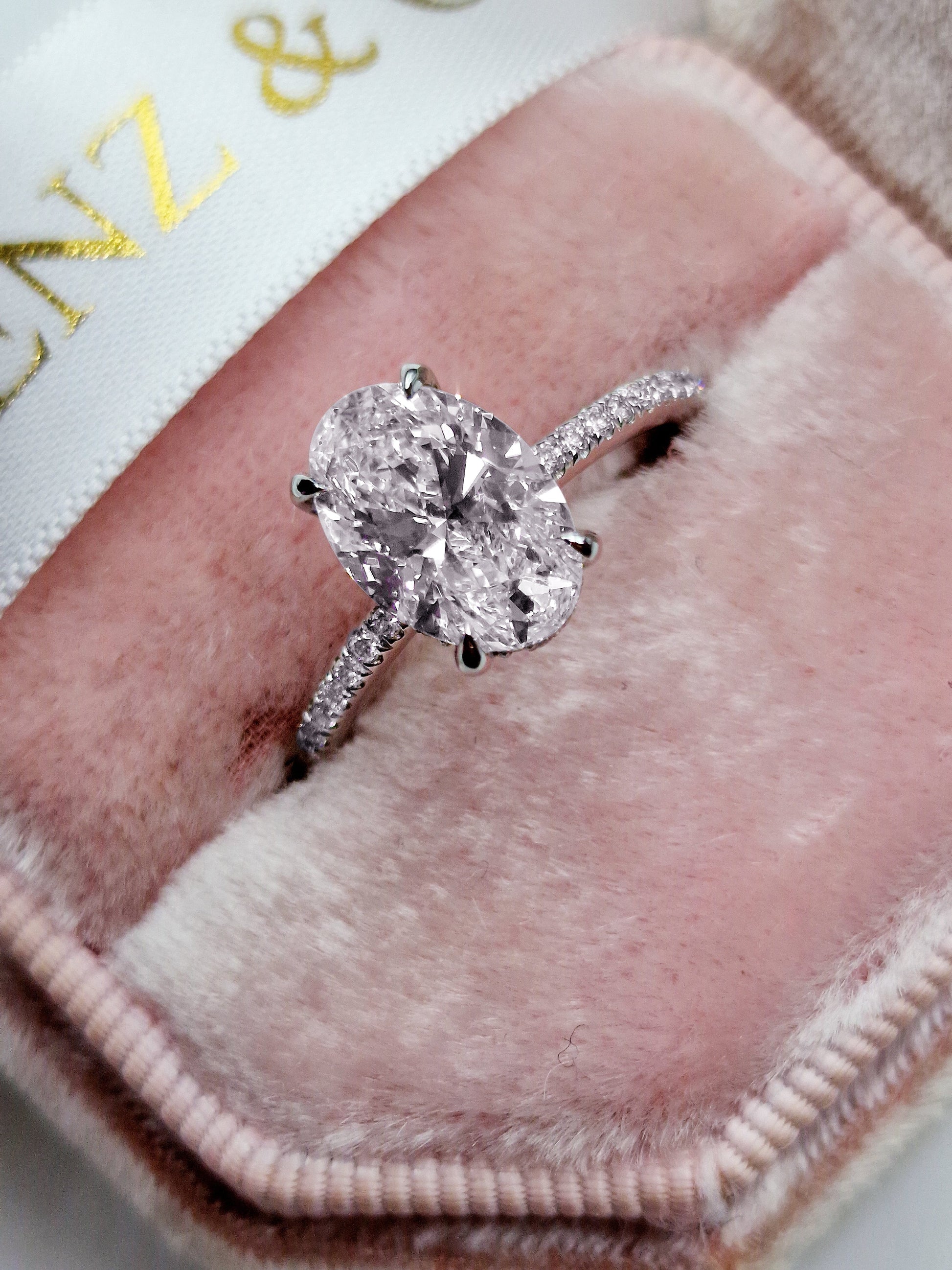 Oval cut 2ct lab grown diamond engagement ring with hidden halo