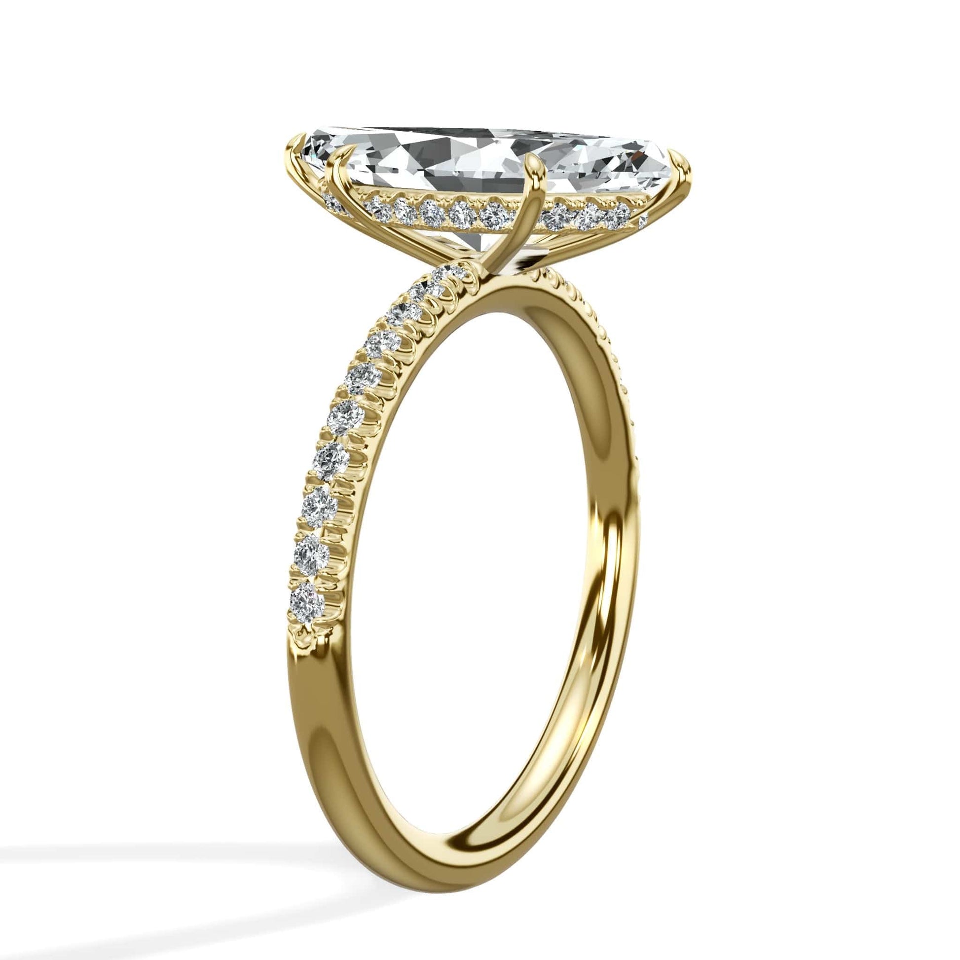 Marquise diamond ring with round diamond accents in yellow gold