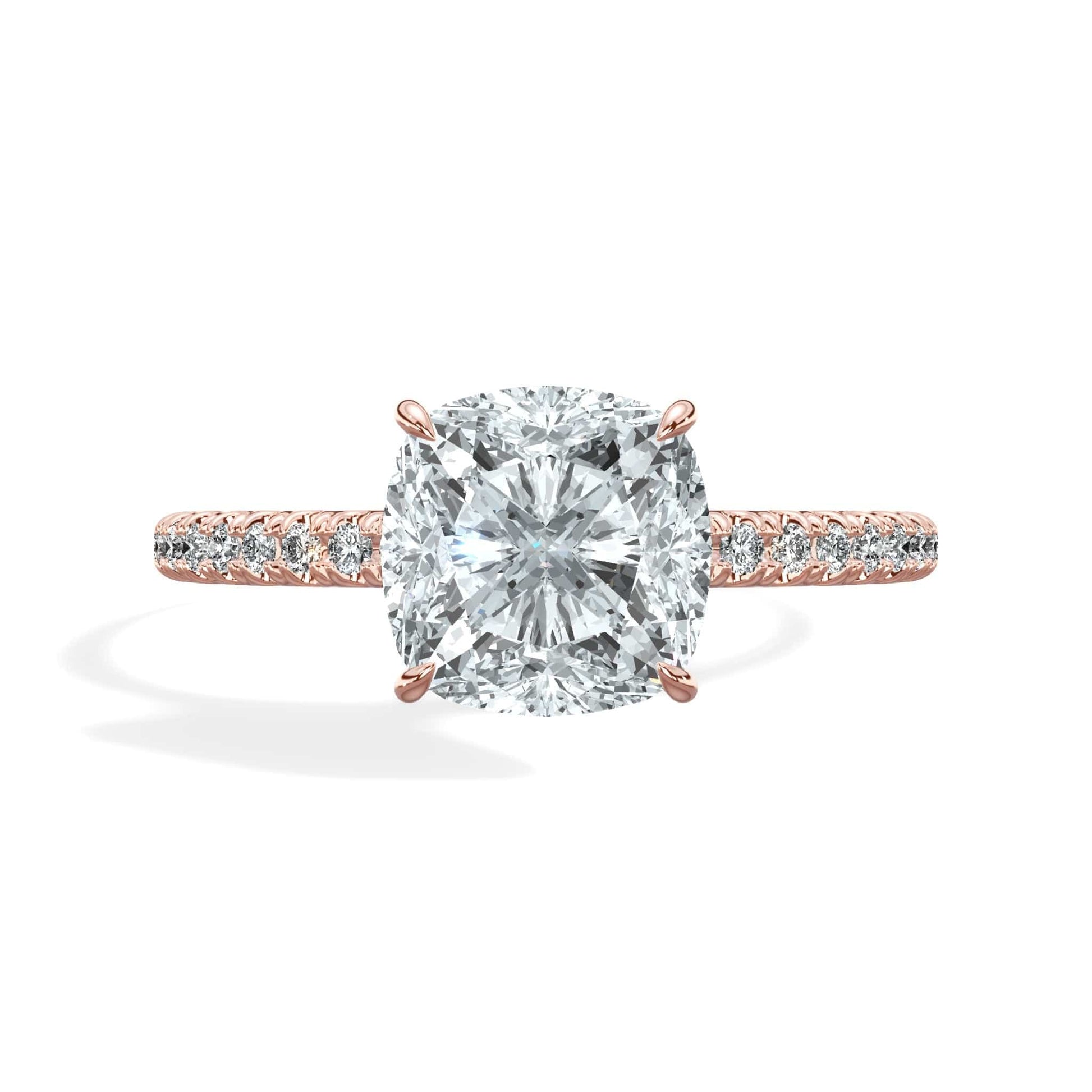Cushion cut diamond ring with princess cut diamond accents in rose gold