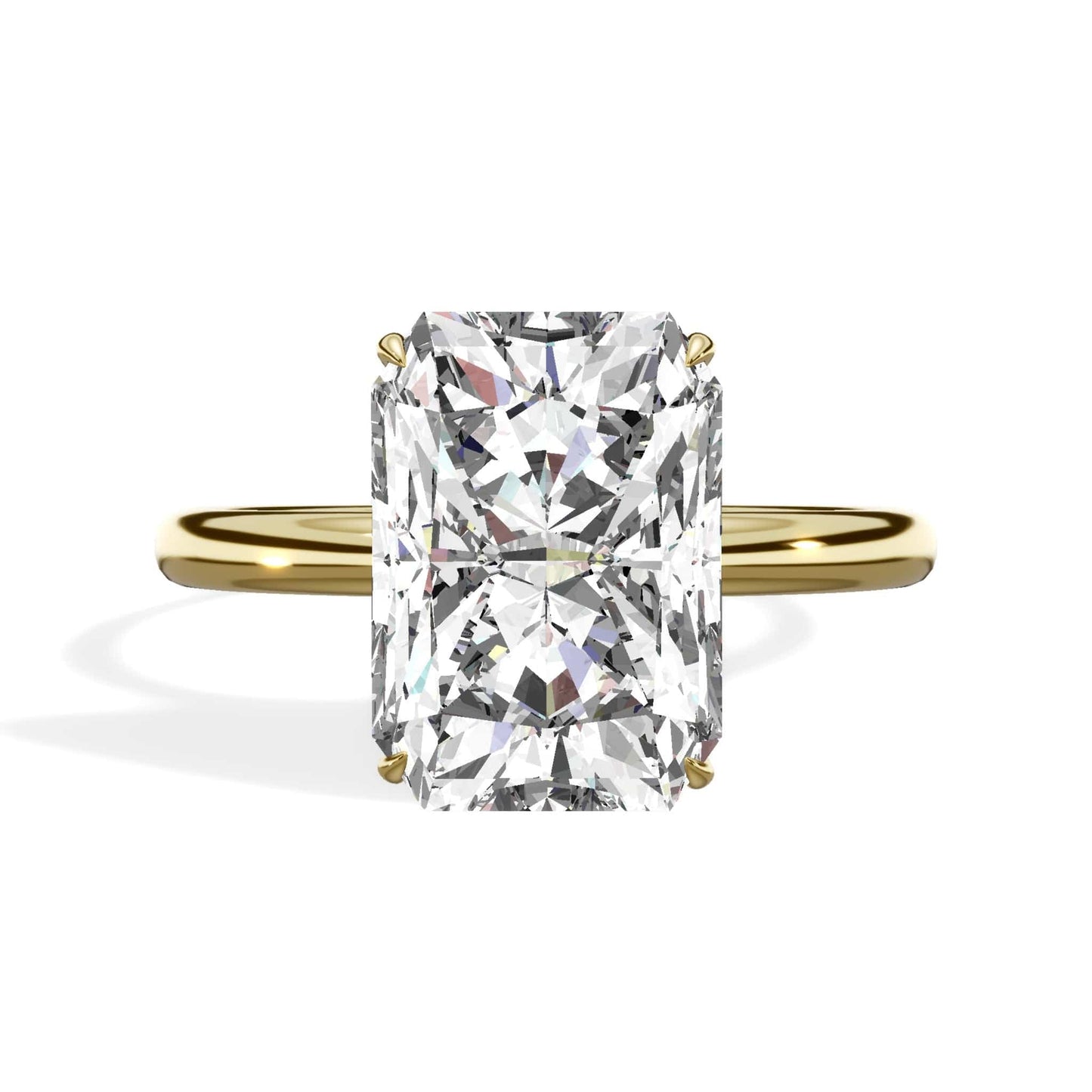 Elongated radiant cut diamond ring in yellow gold