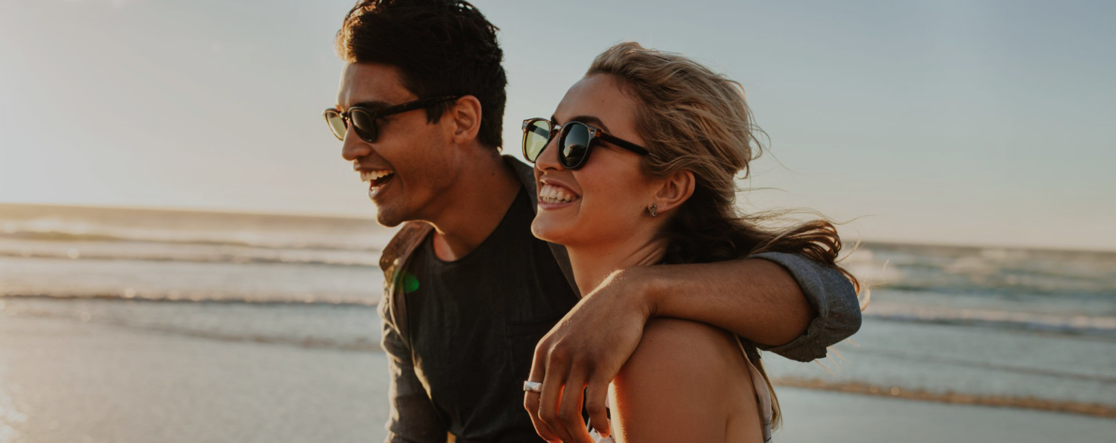 Couple at beach laughing, Rectangle_50_3