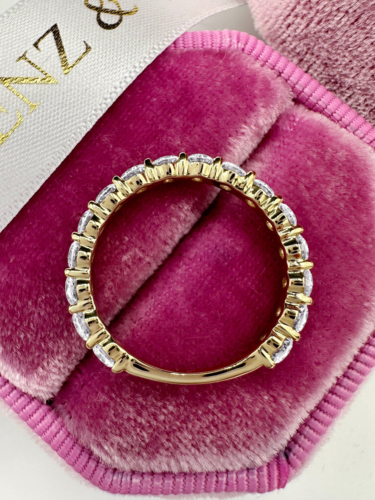 Round cut lab grown diamond eternity ring in 14k yellow gold