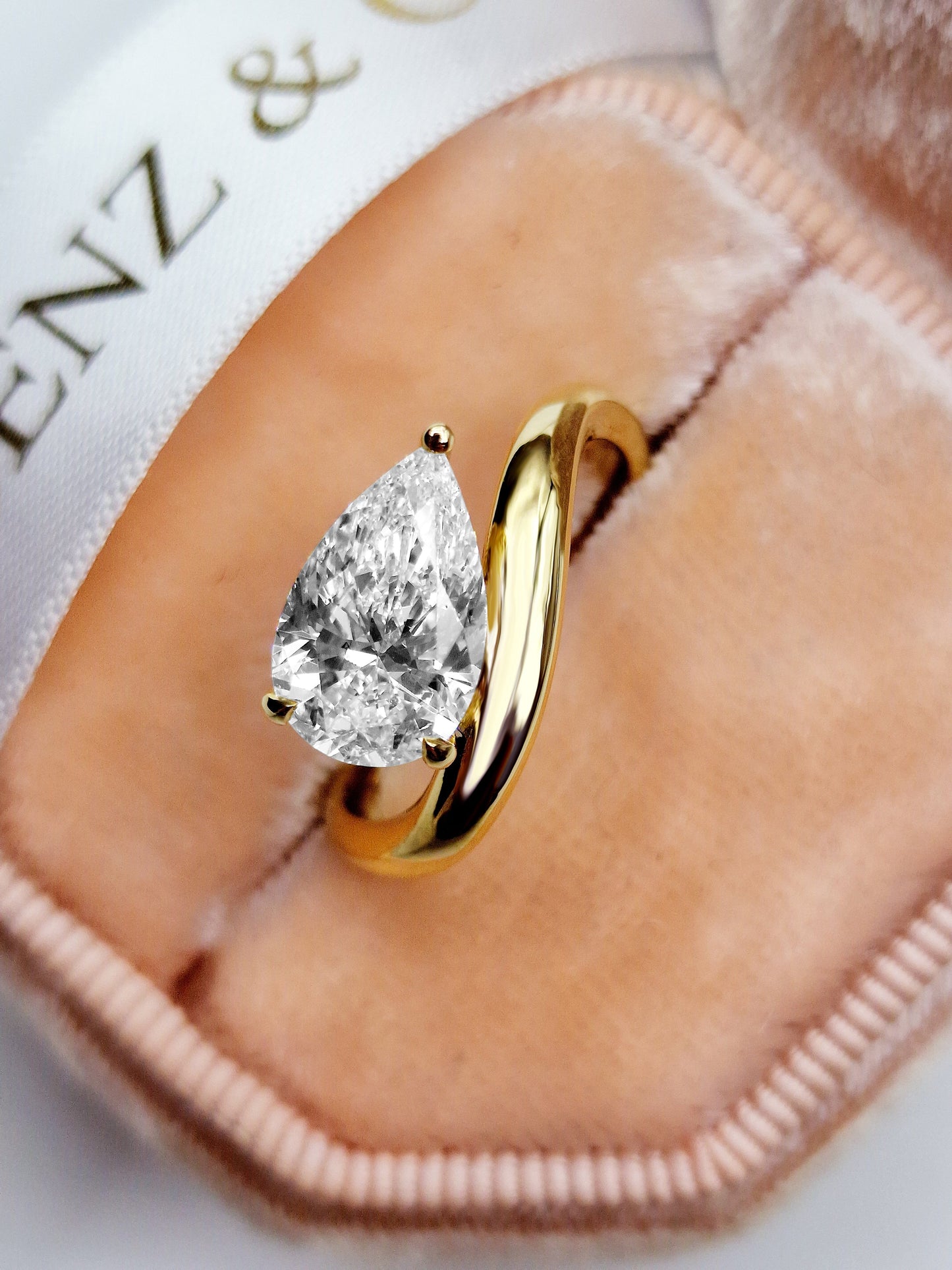 Yellow gold pear-shaped diamond solitaire engagement ring