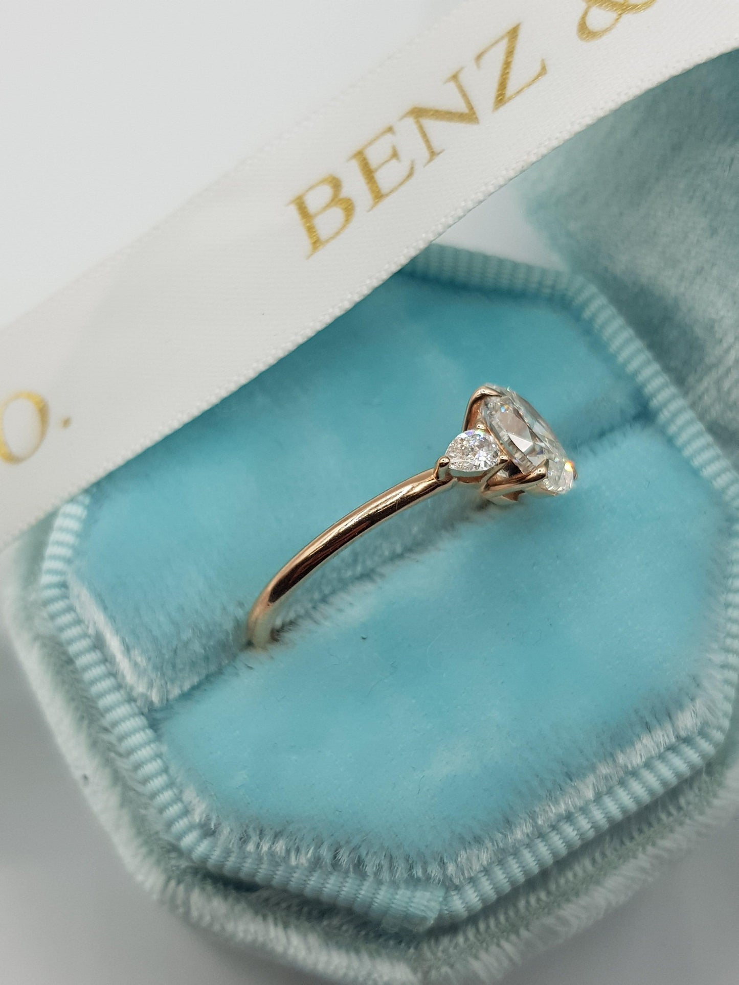 1.30 Carats Oval Cut with Pear Shape Side Stones Diamond Engagement Ring in Rose Gold - BenzDiamonds
