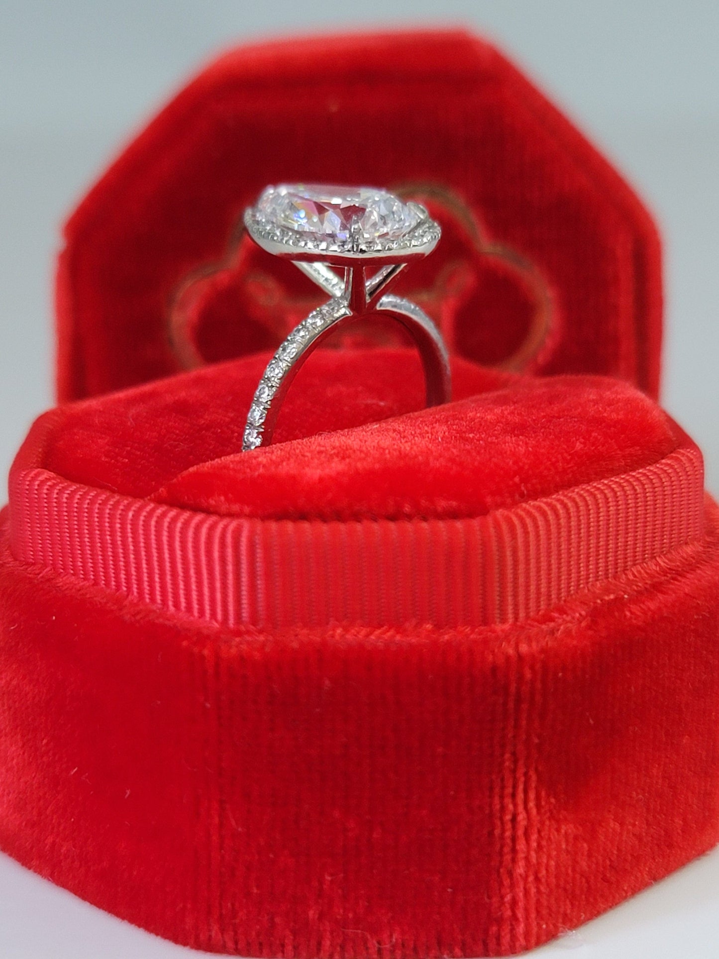 Diamond ring in a red velvet box.