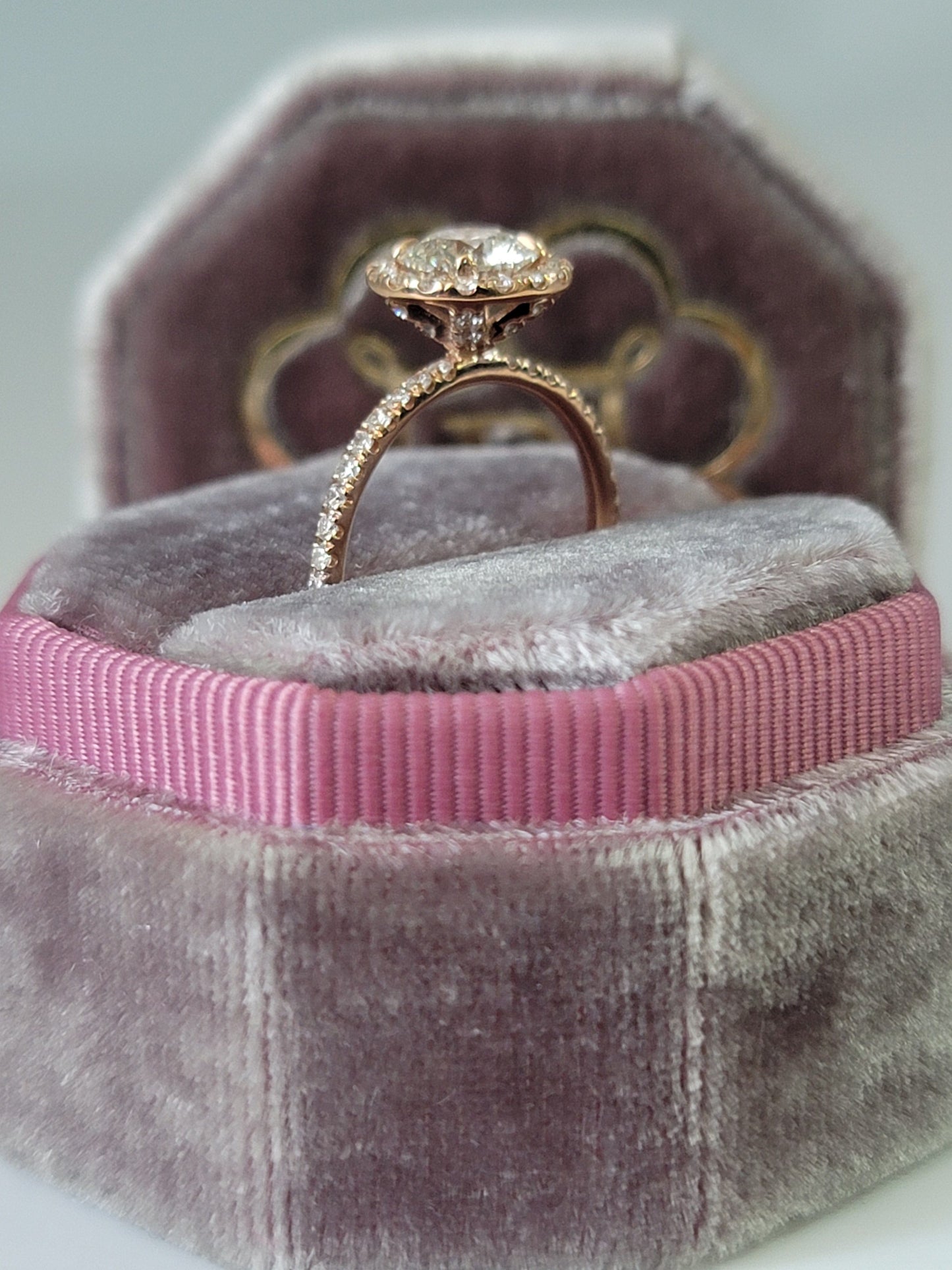 Diamond ring in a velvet ring box.