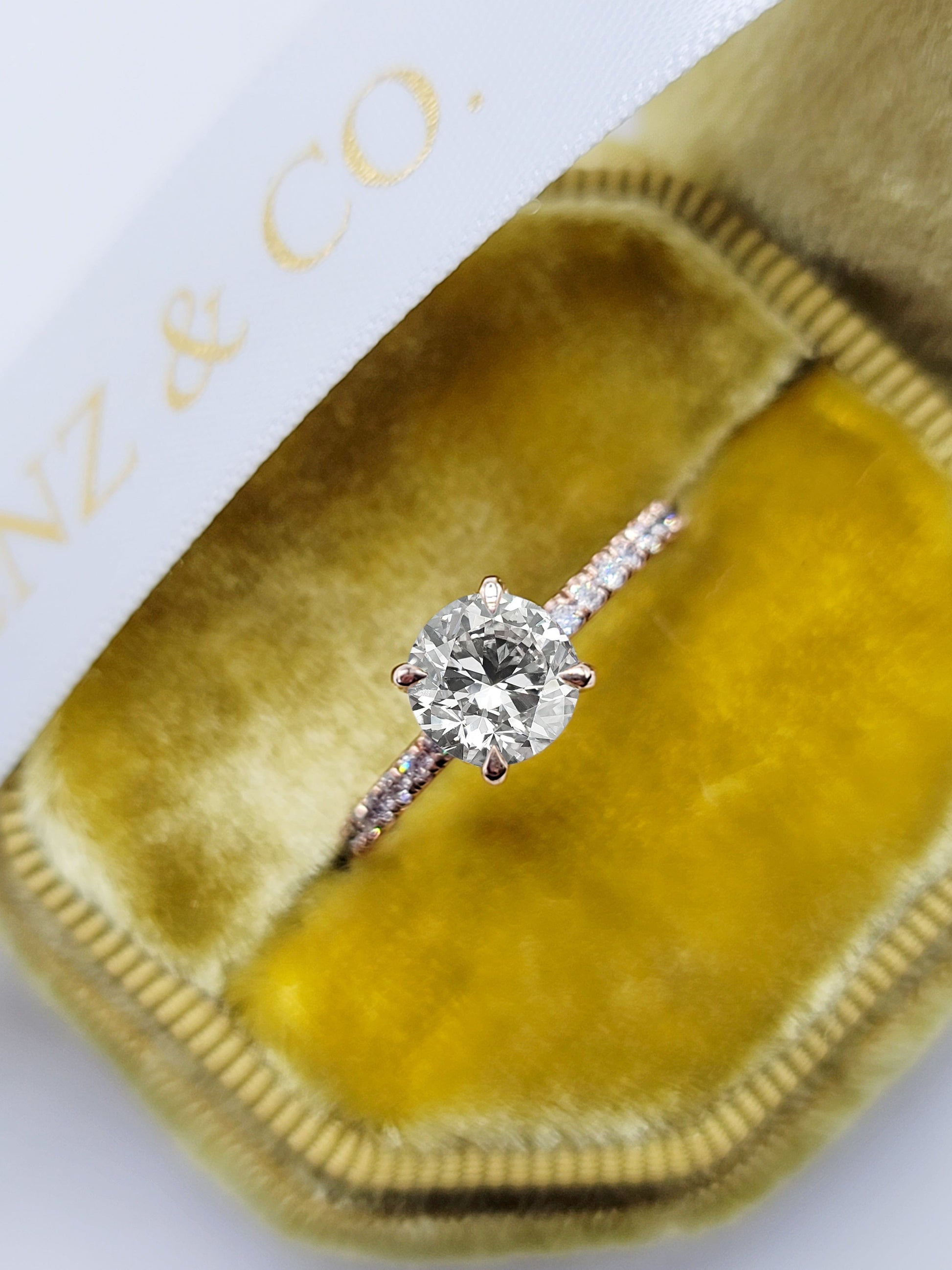 Diamond ring in a velvet jewelry box.