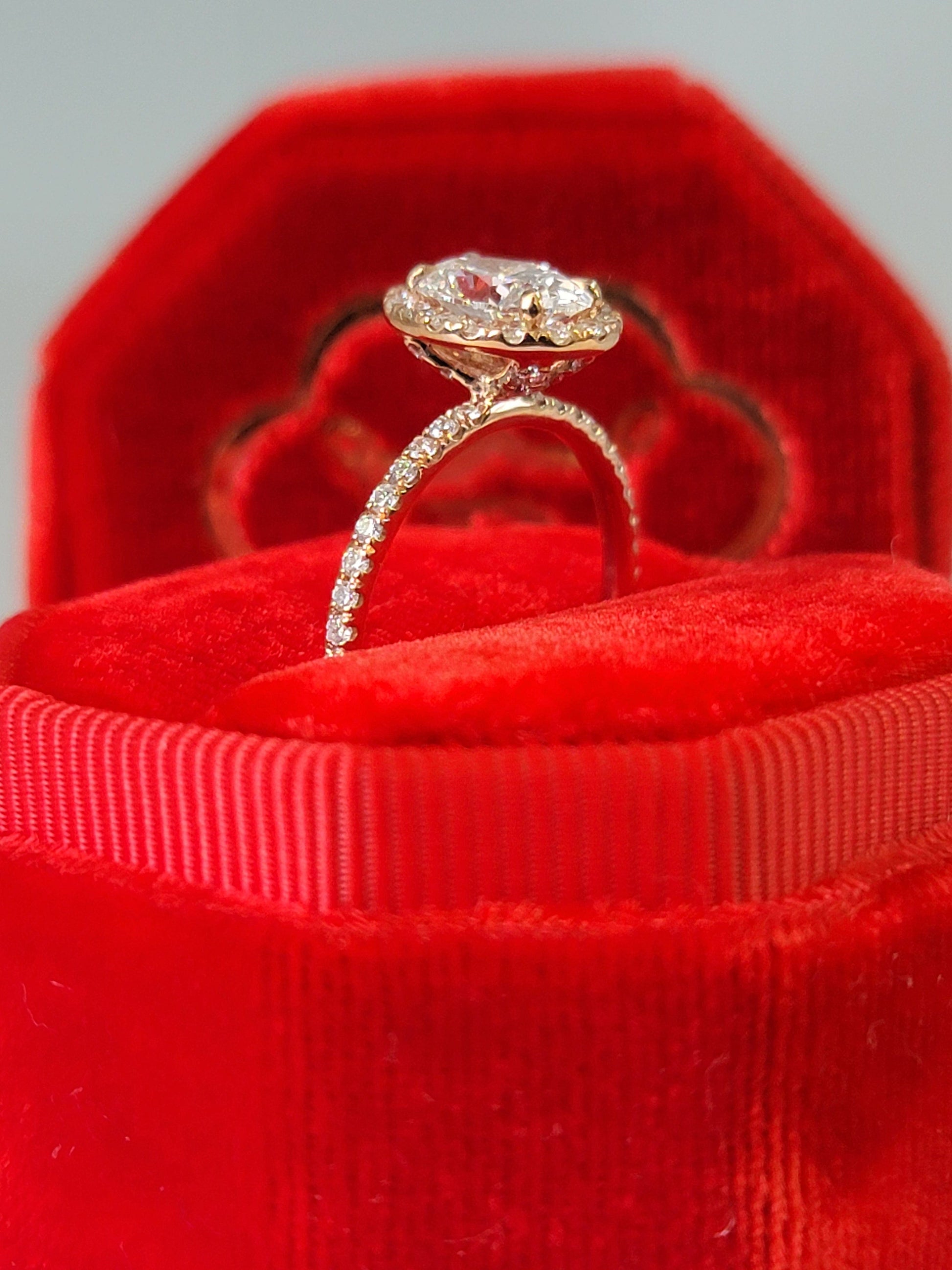 Diamond ring in a red velvet box.